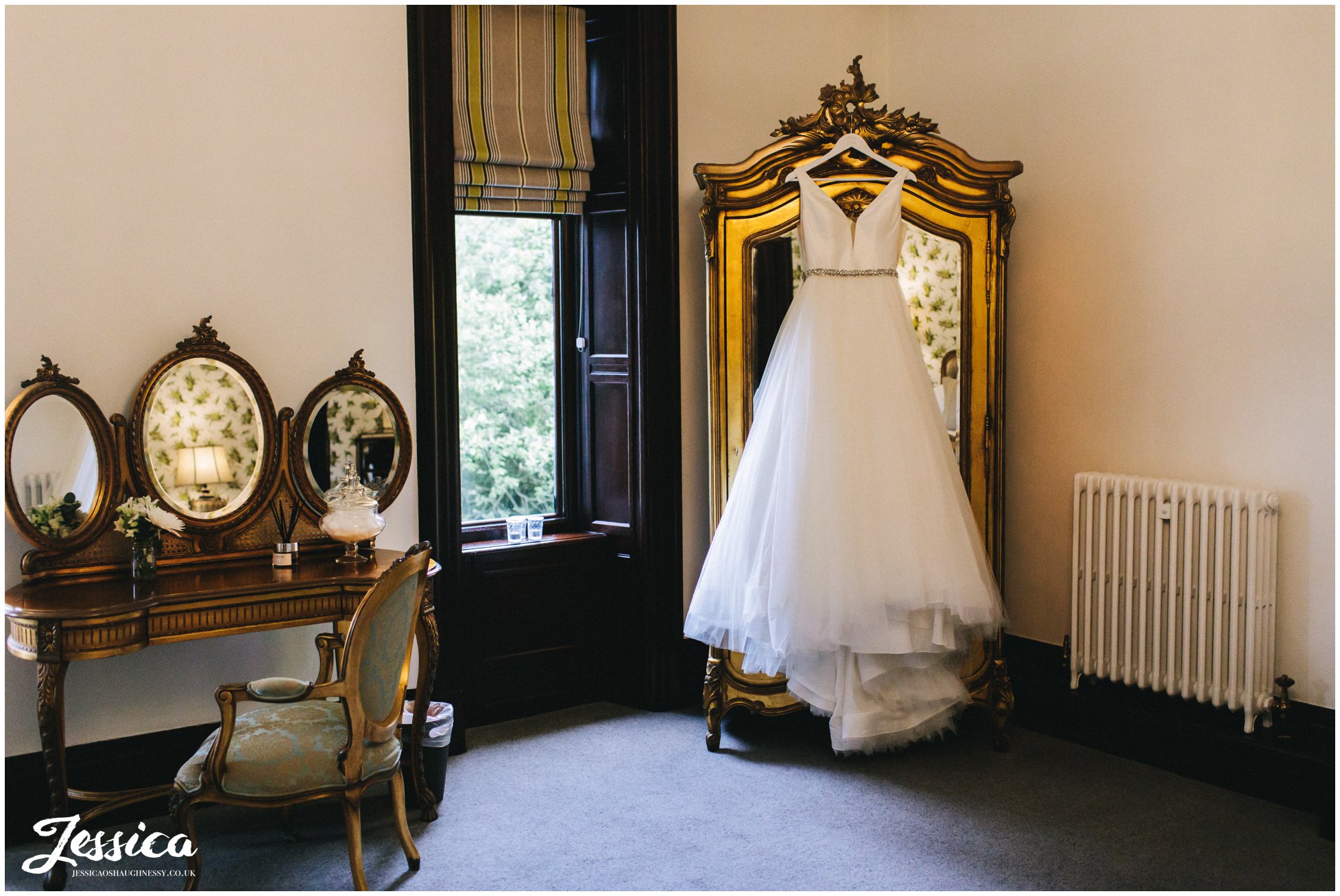 wedding dress hanging in tyn dwr halls bridal suite