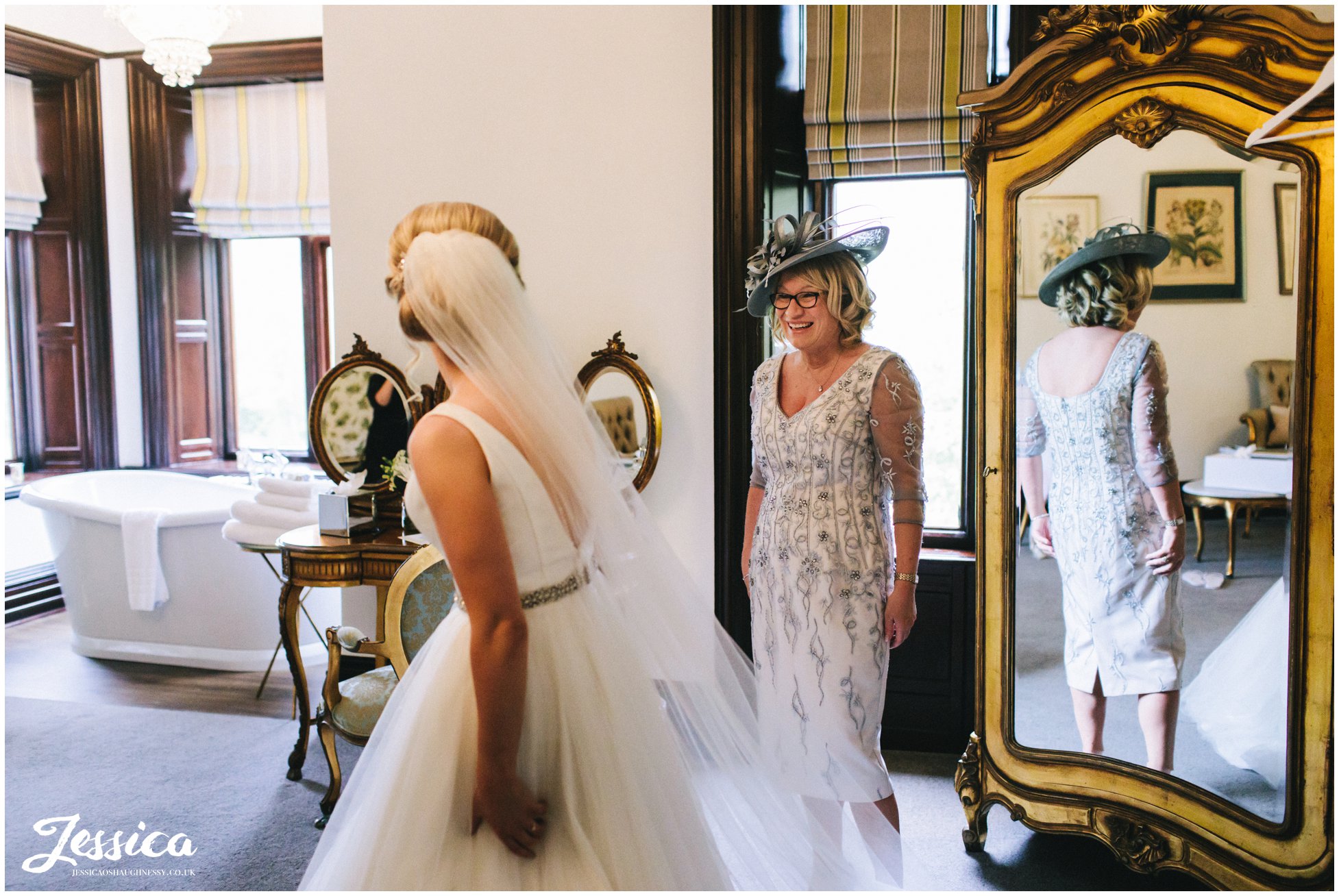 mother of the bride admires her daughter