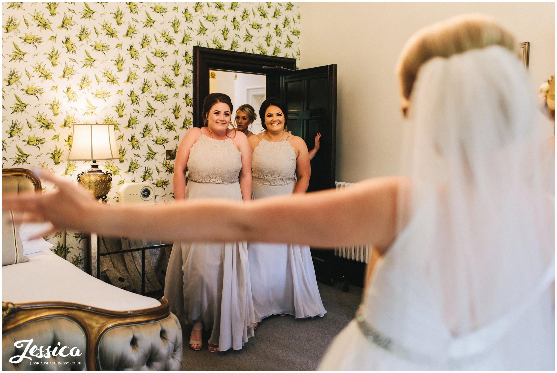 bride reveals dress to her bridesmaids