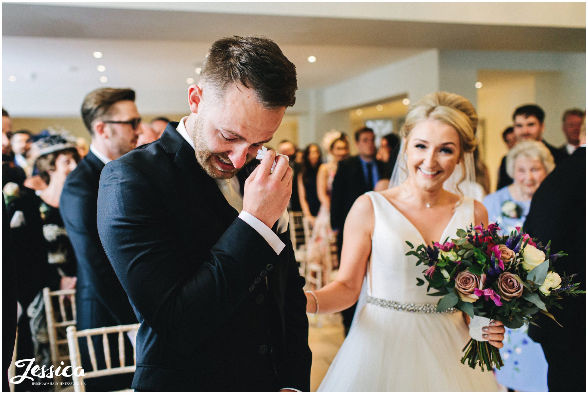 groom cries as he see's the bride for the first time