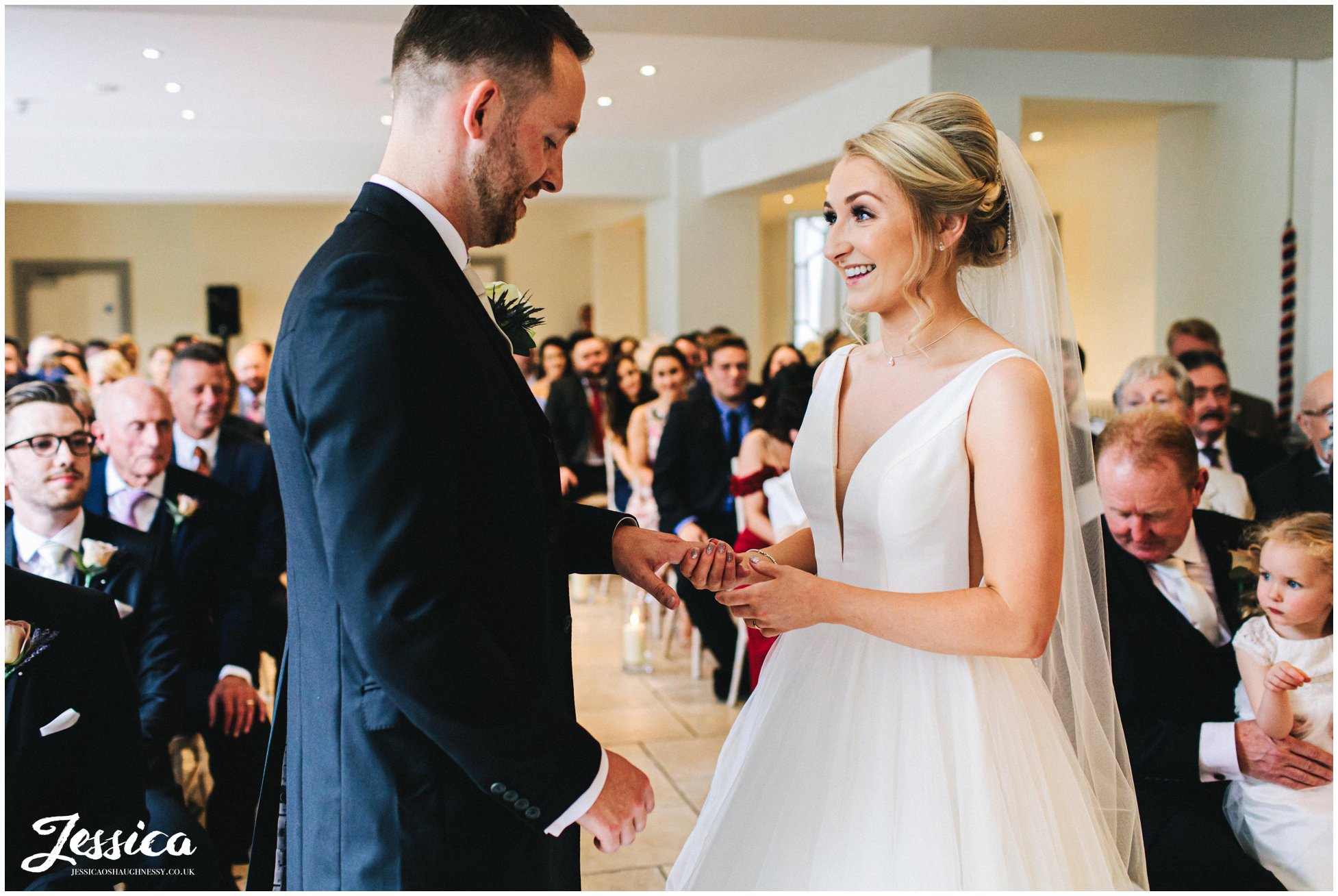 the couple exchange rings during their ceremony
