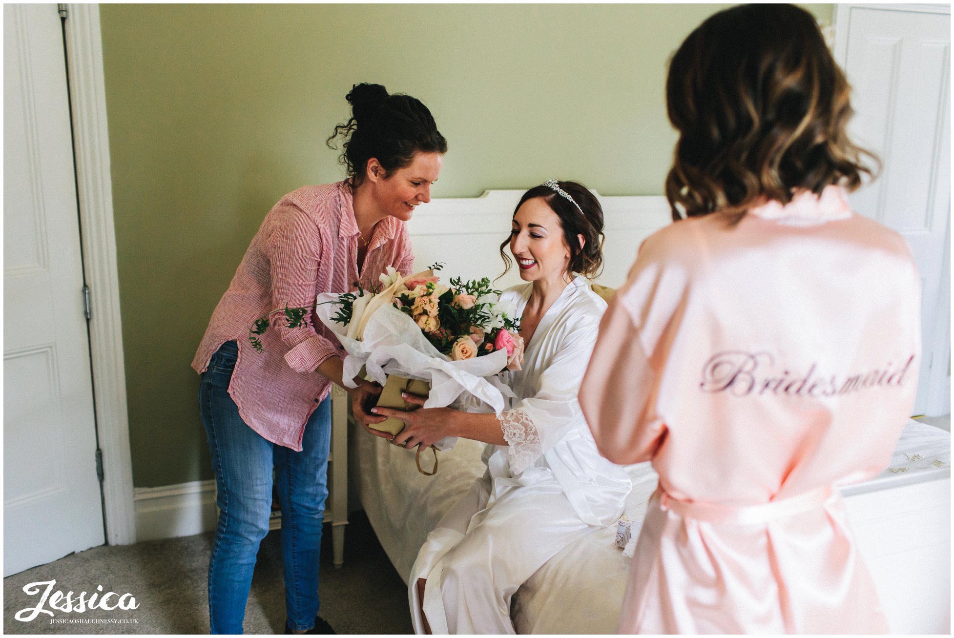 the florist arrives and shows the bride her bouquet