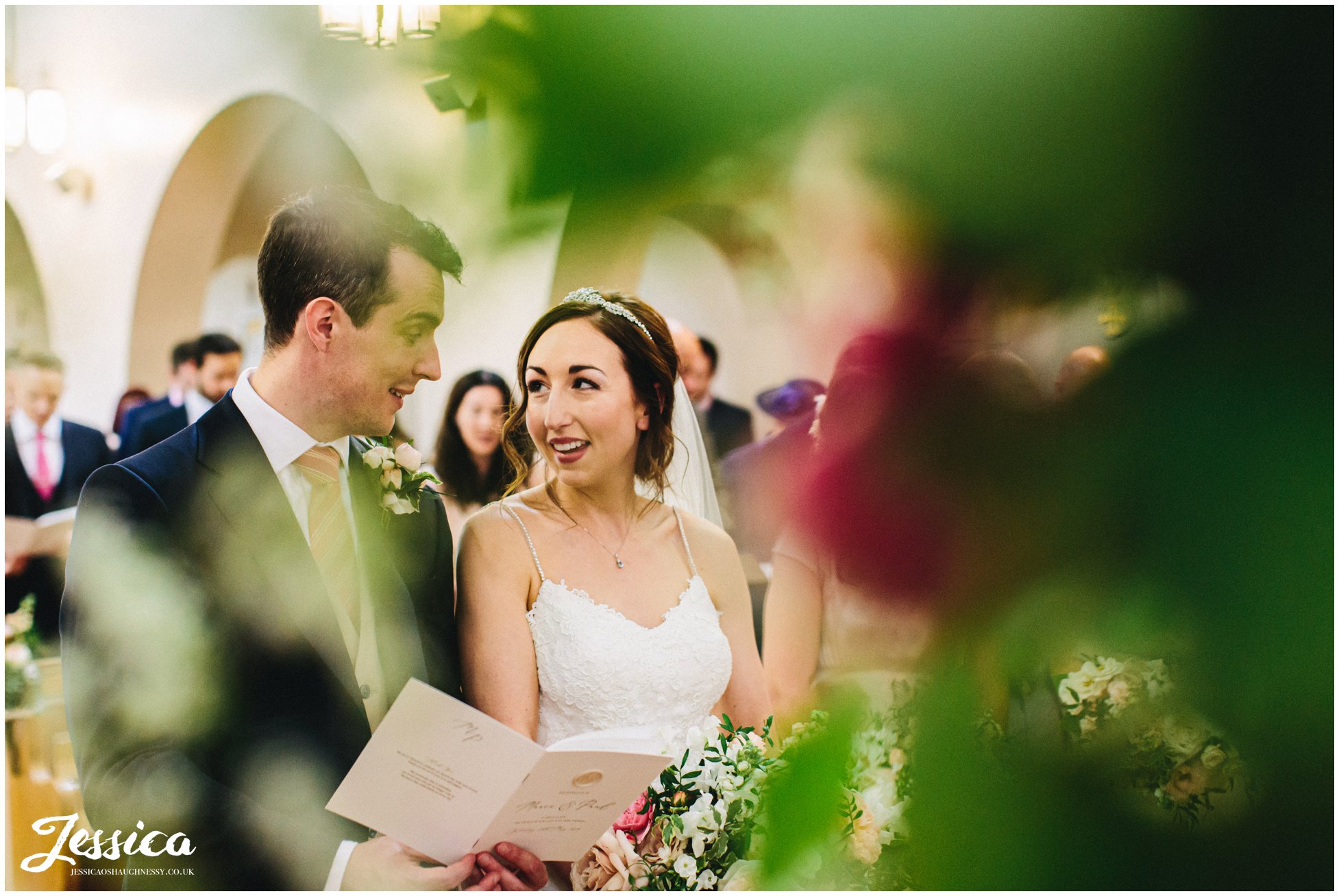 the couple sign during their church service