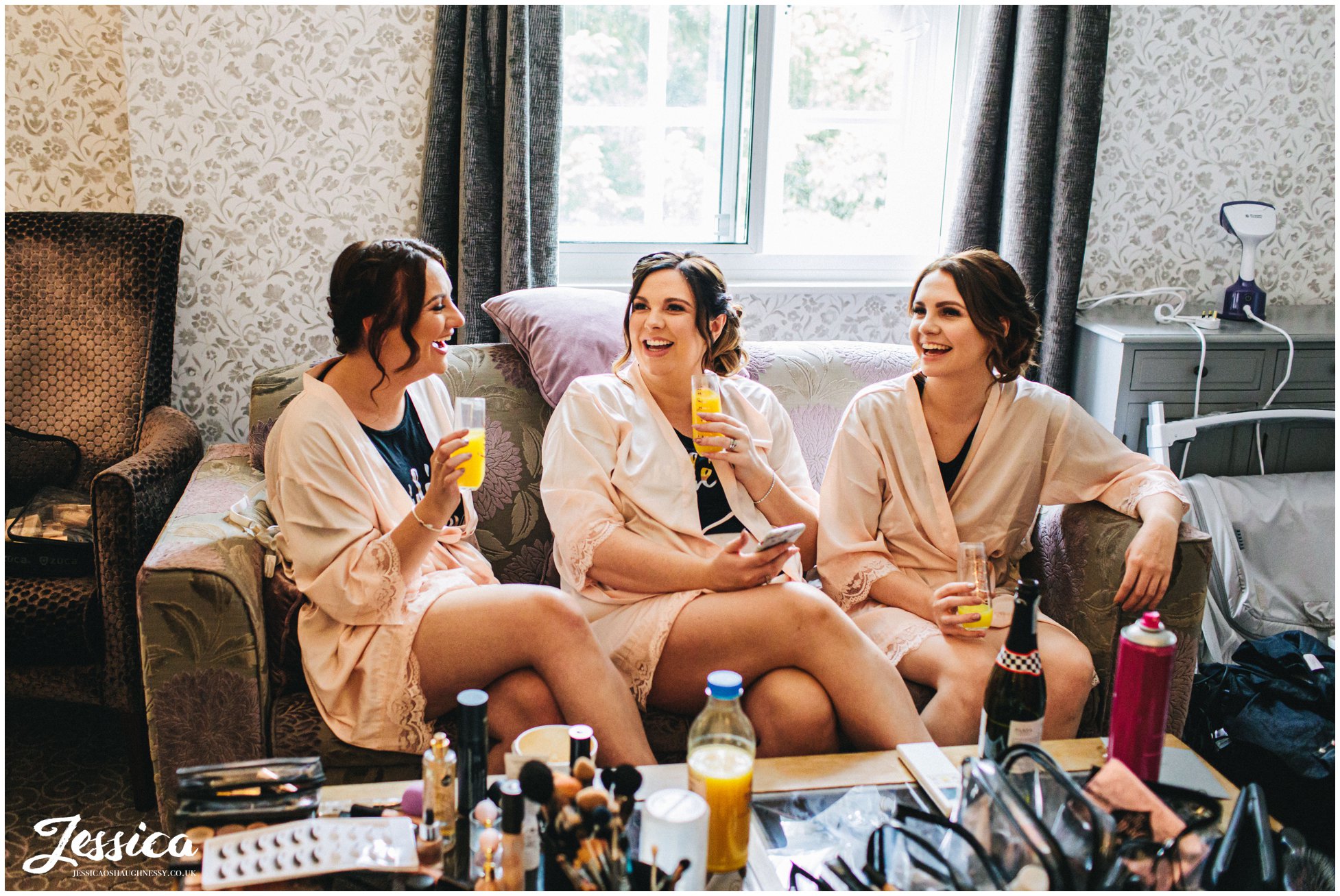 bridesmaids drink prosecco on the morning of the wedding