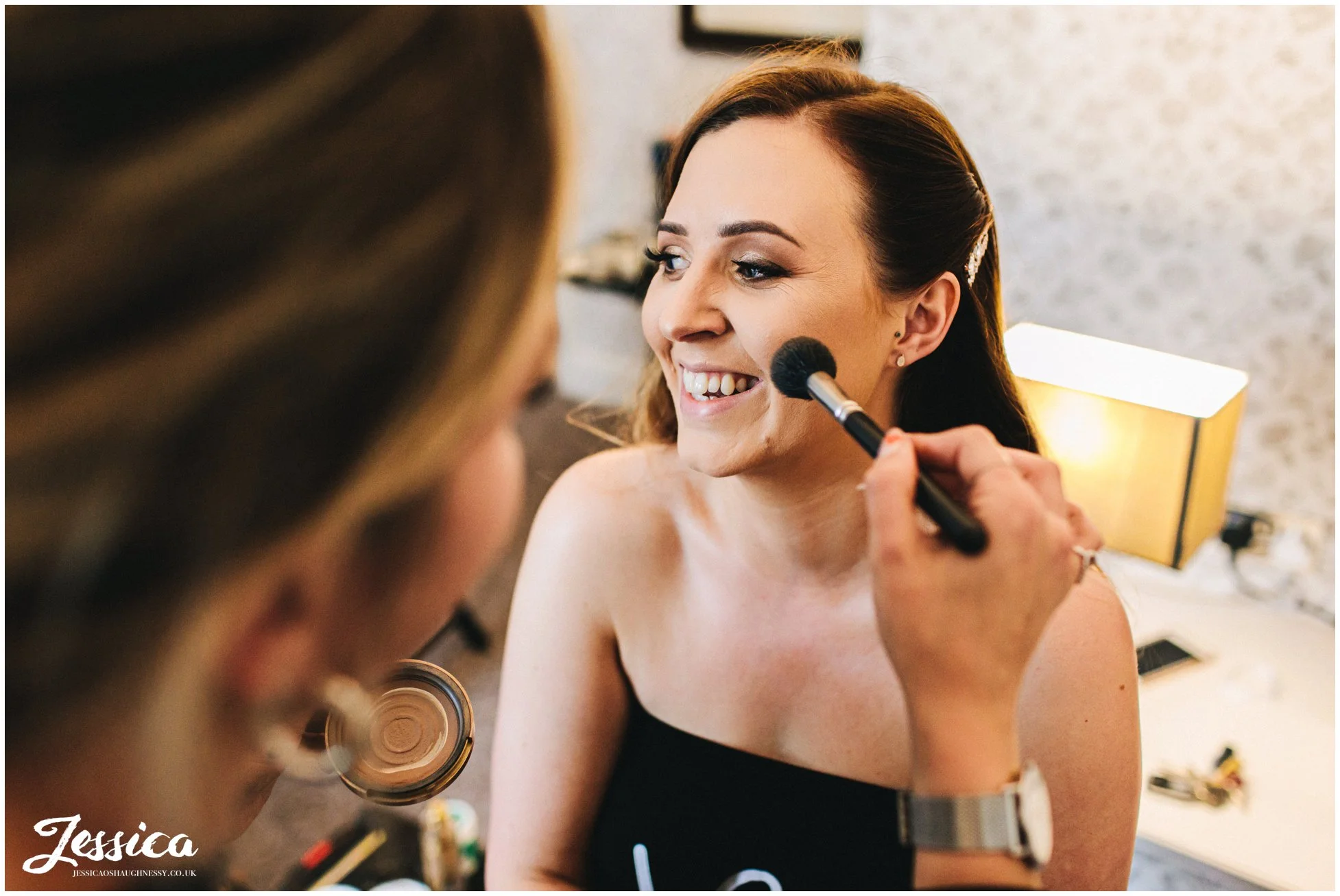bride gets make up done for mottram hall wedding