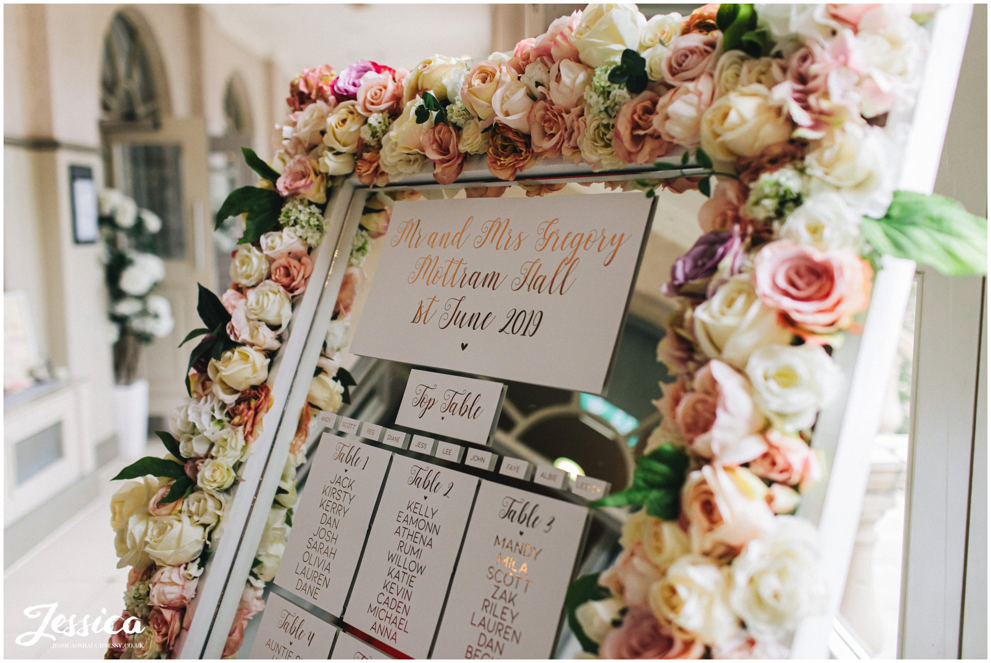 floral table plan decorates the corridor