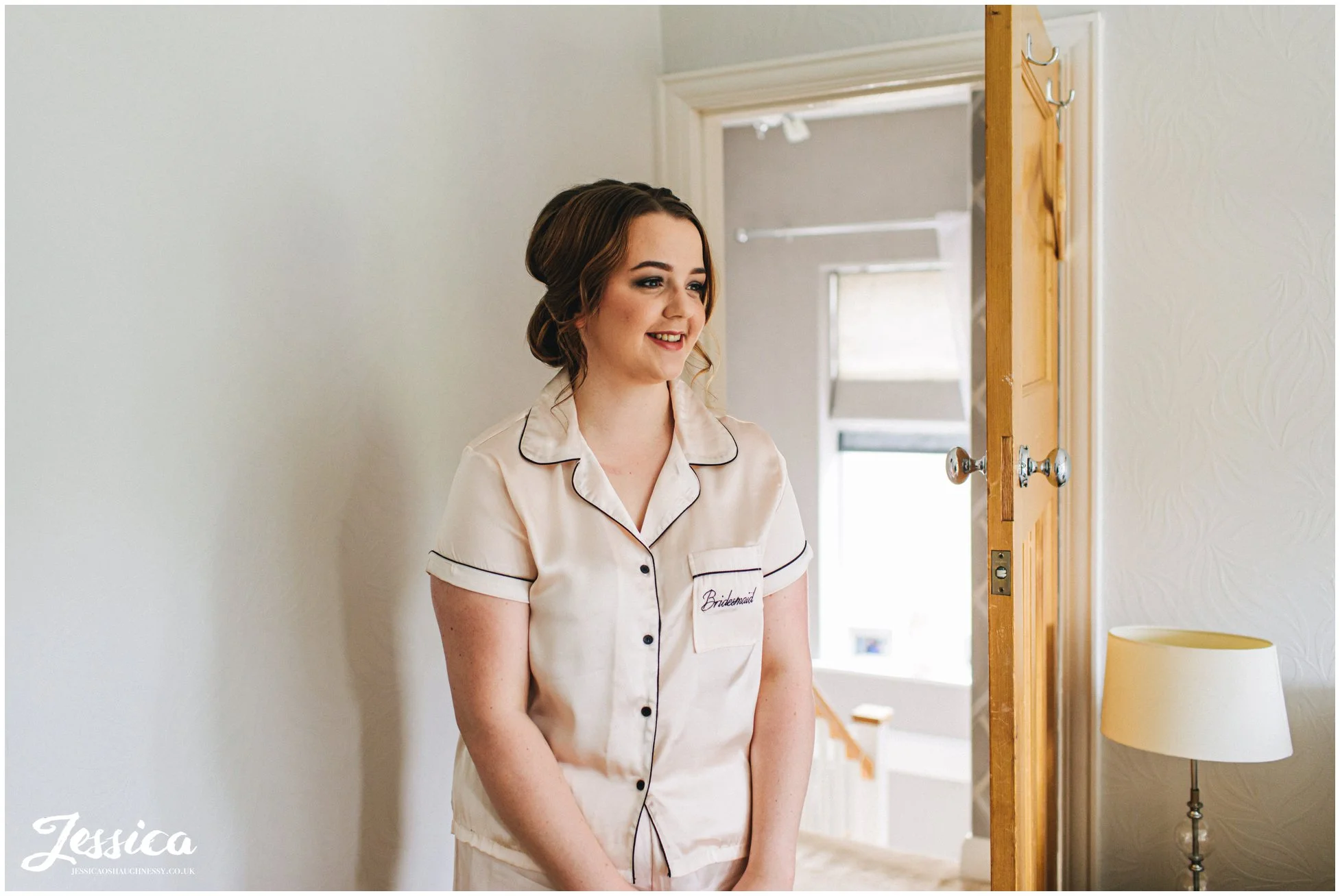 Brides sister admires her in her dress