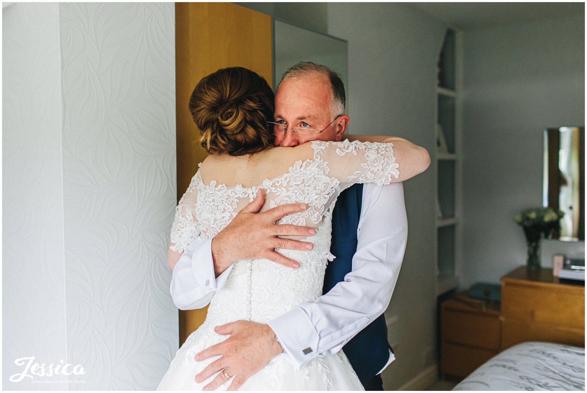 father of the bride cries seeing his daughter in her dress