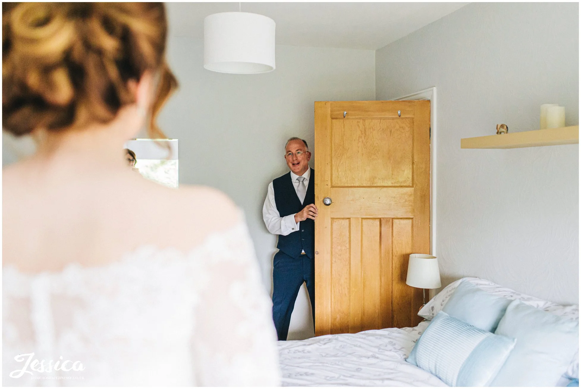 father of the bride sees his daughter for the first time on the wedding day