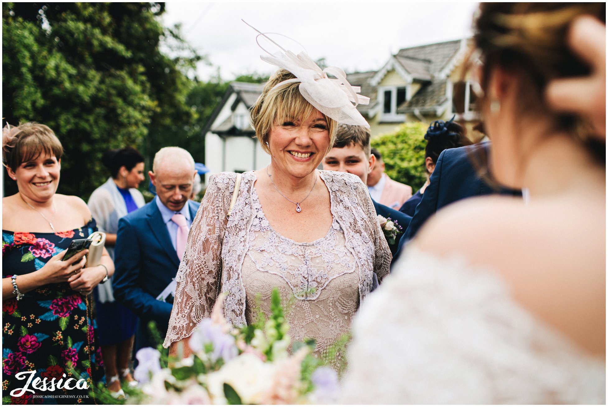 mother of the groom smiles at daughter-in-law