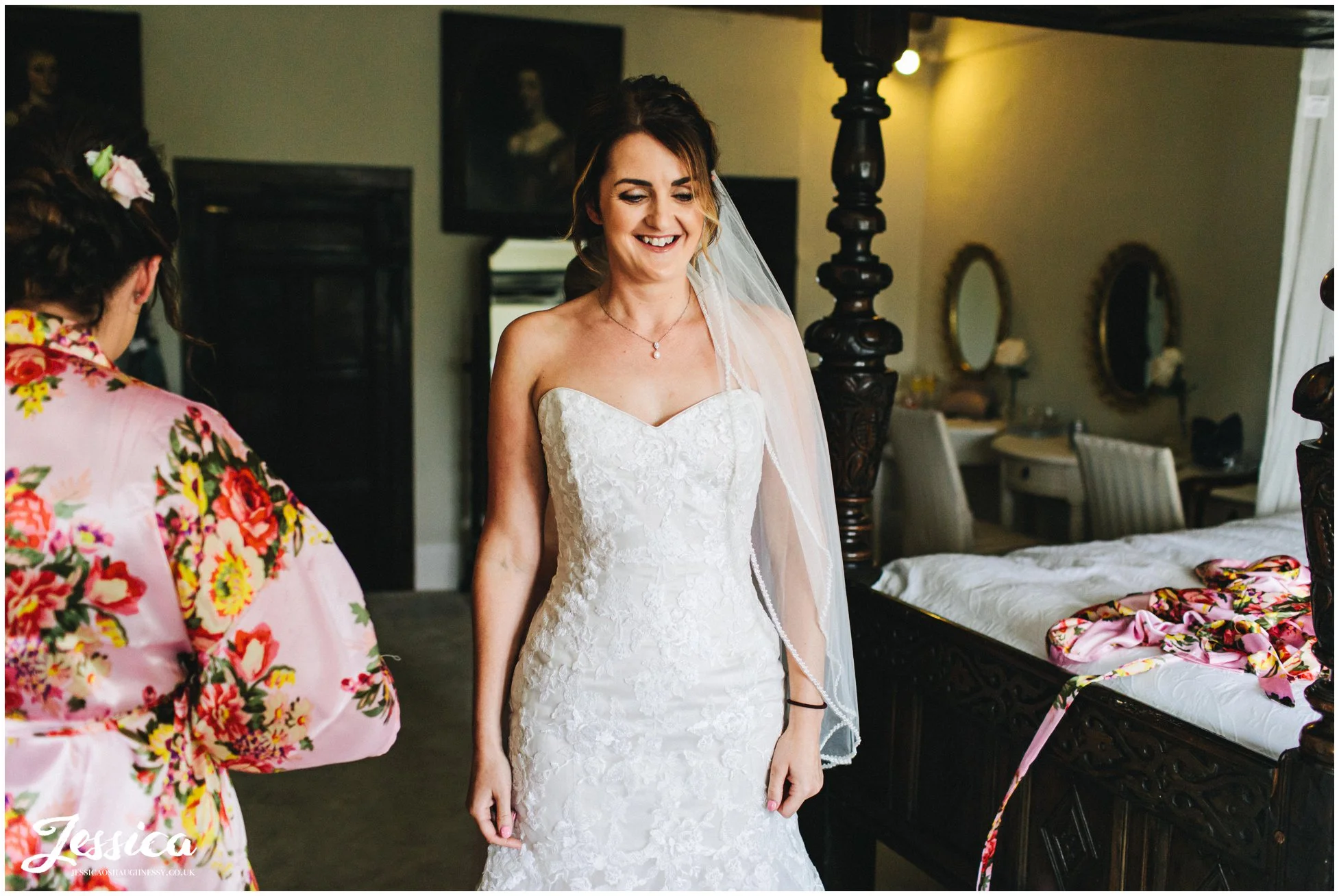 bride gets into her wedding dress ready for the ceremony