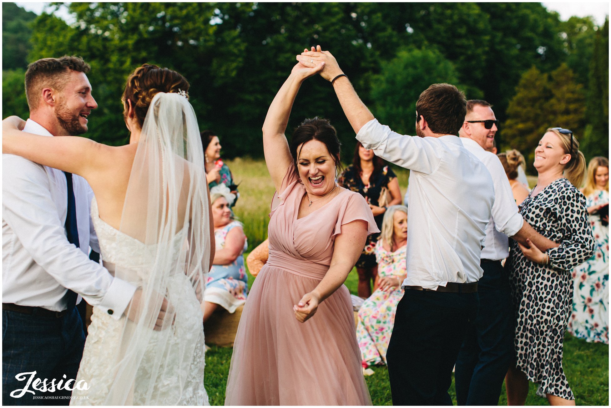 guests join the couple and dance outside on the lawn