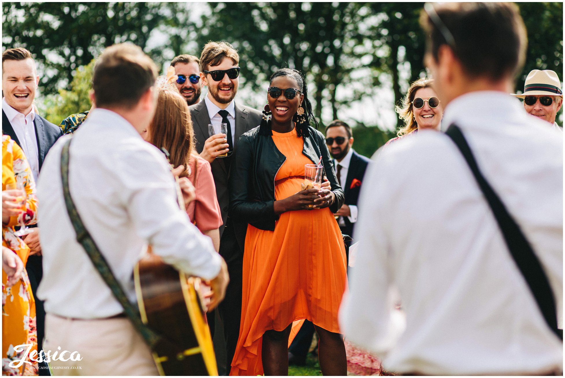 guests watch the entertainment at the outbuildings in anglesey