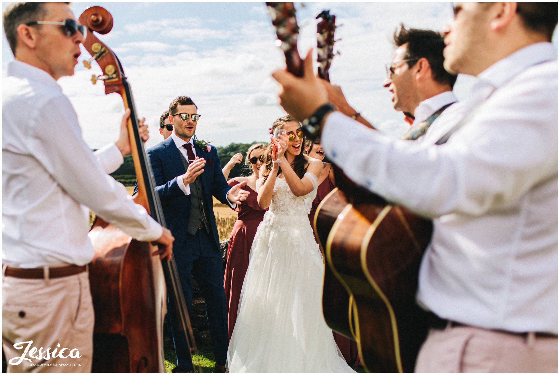 the newly wed's applaud the band as they finish their set