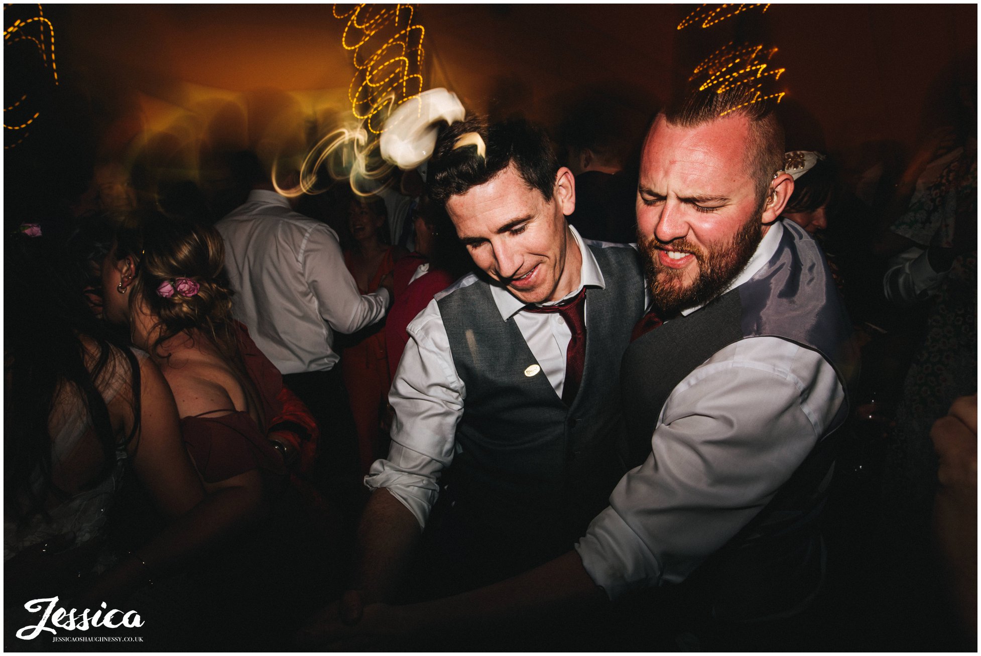 groomsmen dance together at the tipi wedding