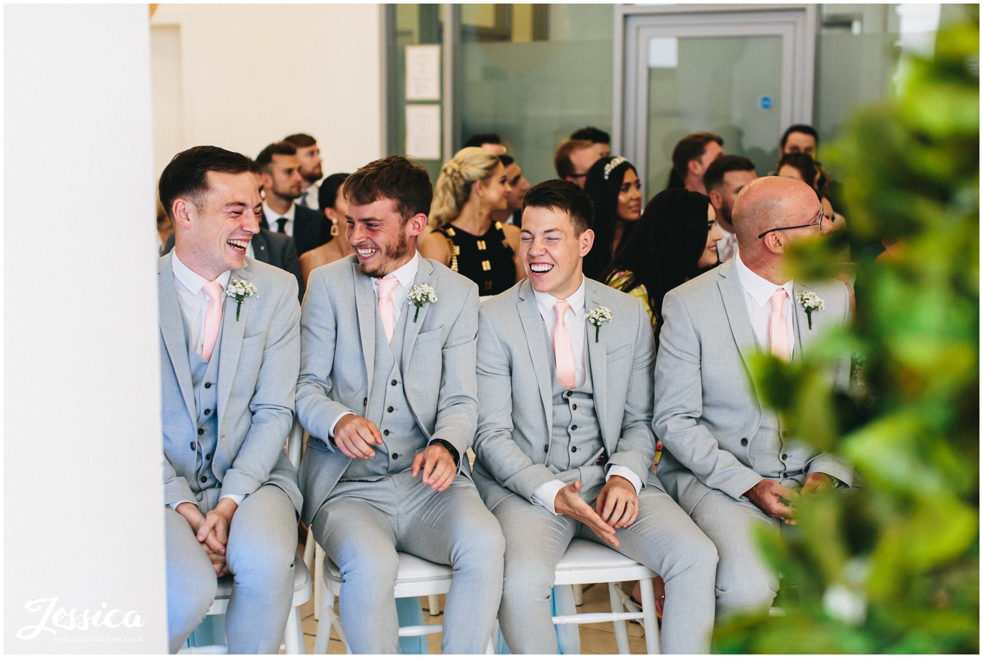 the groomsmen laugh before the liverpool wedding ceremony