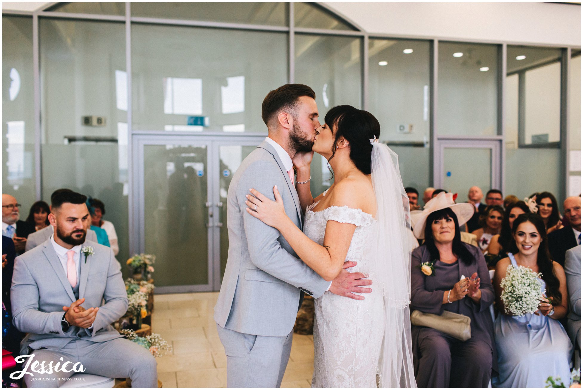 the newly wed's share their first kiss 