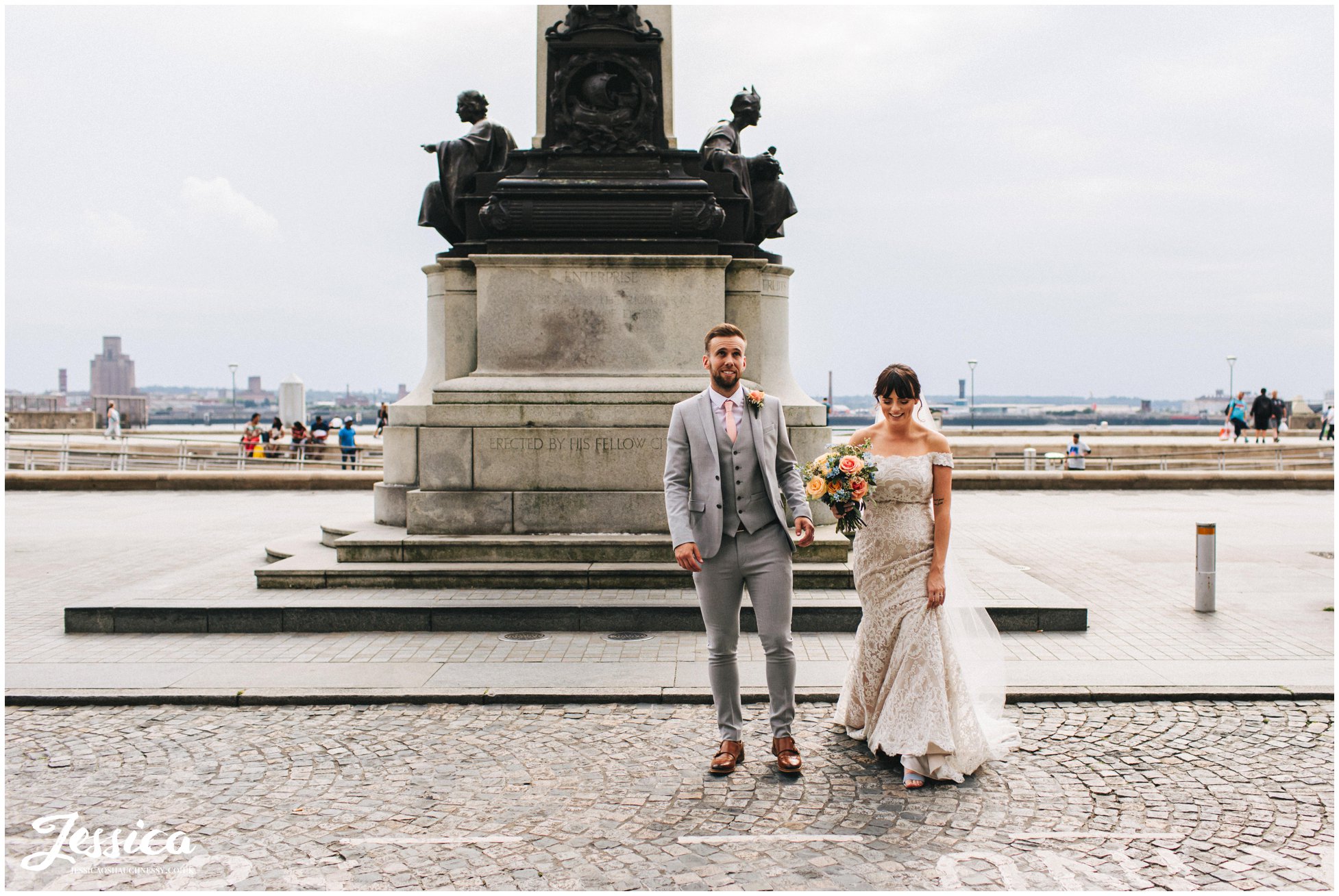 husband and wife cross cobbled liverpool street