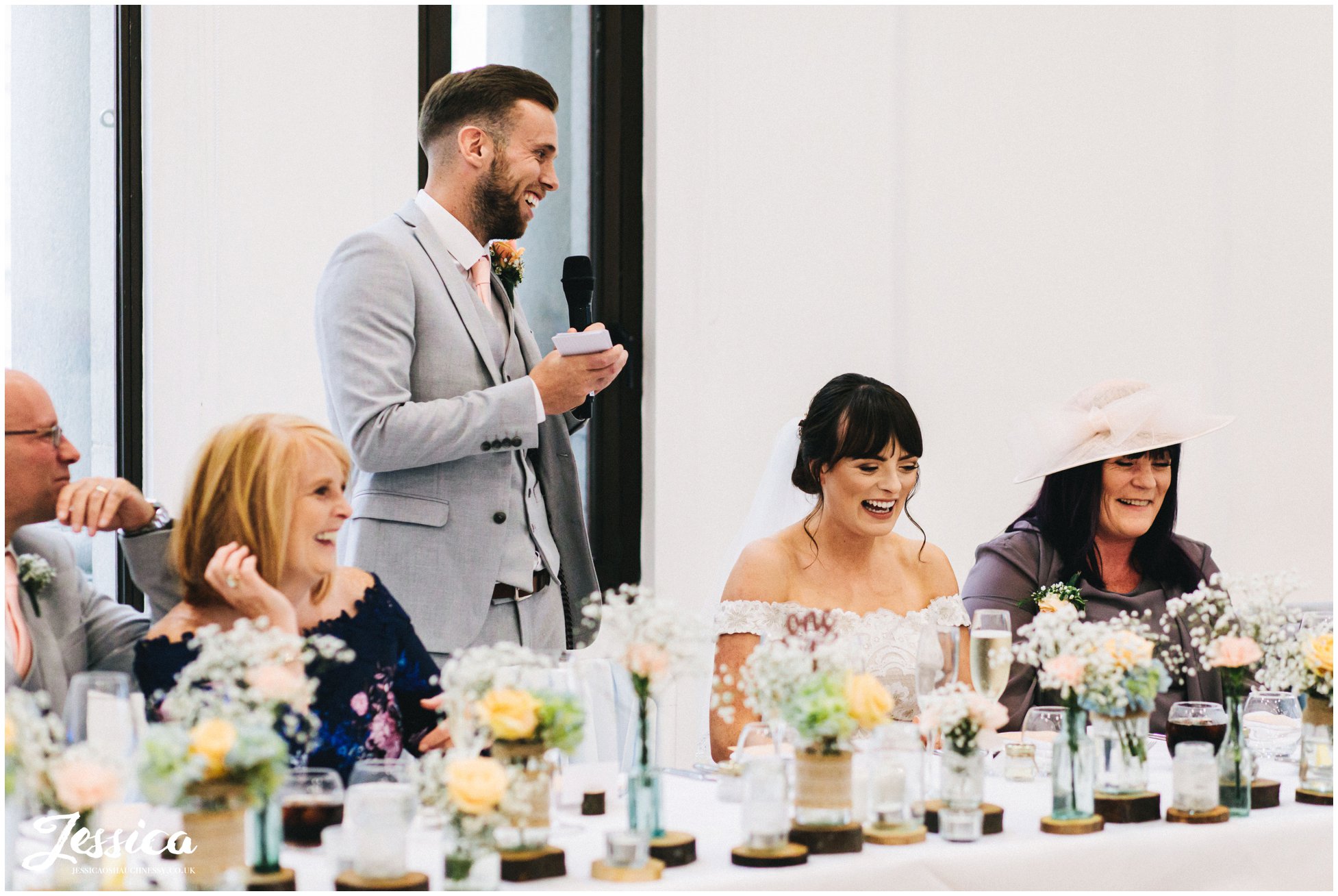 groom stands to give his speech