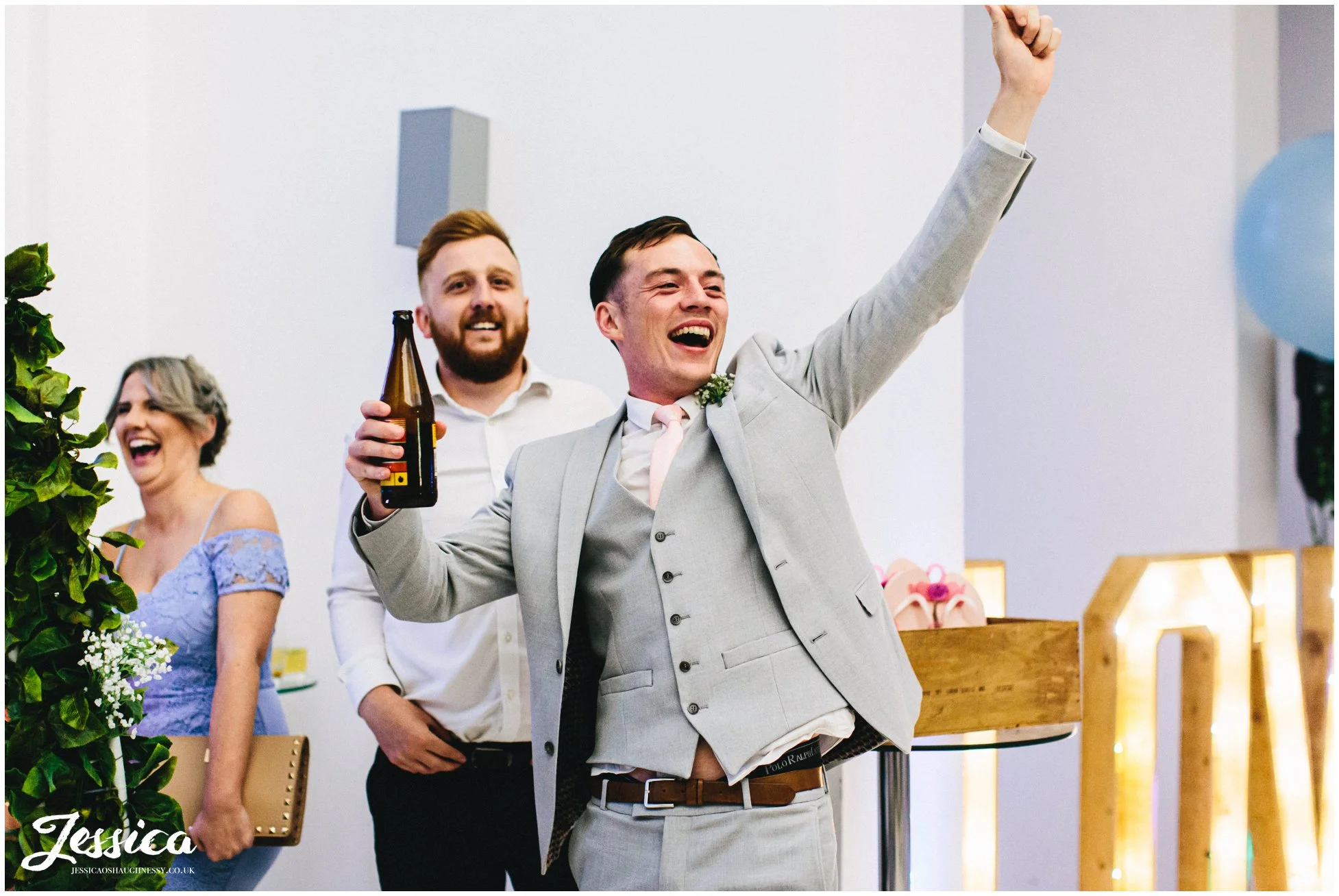 groomsmen cheers as football song is played