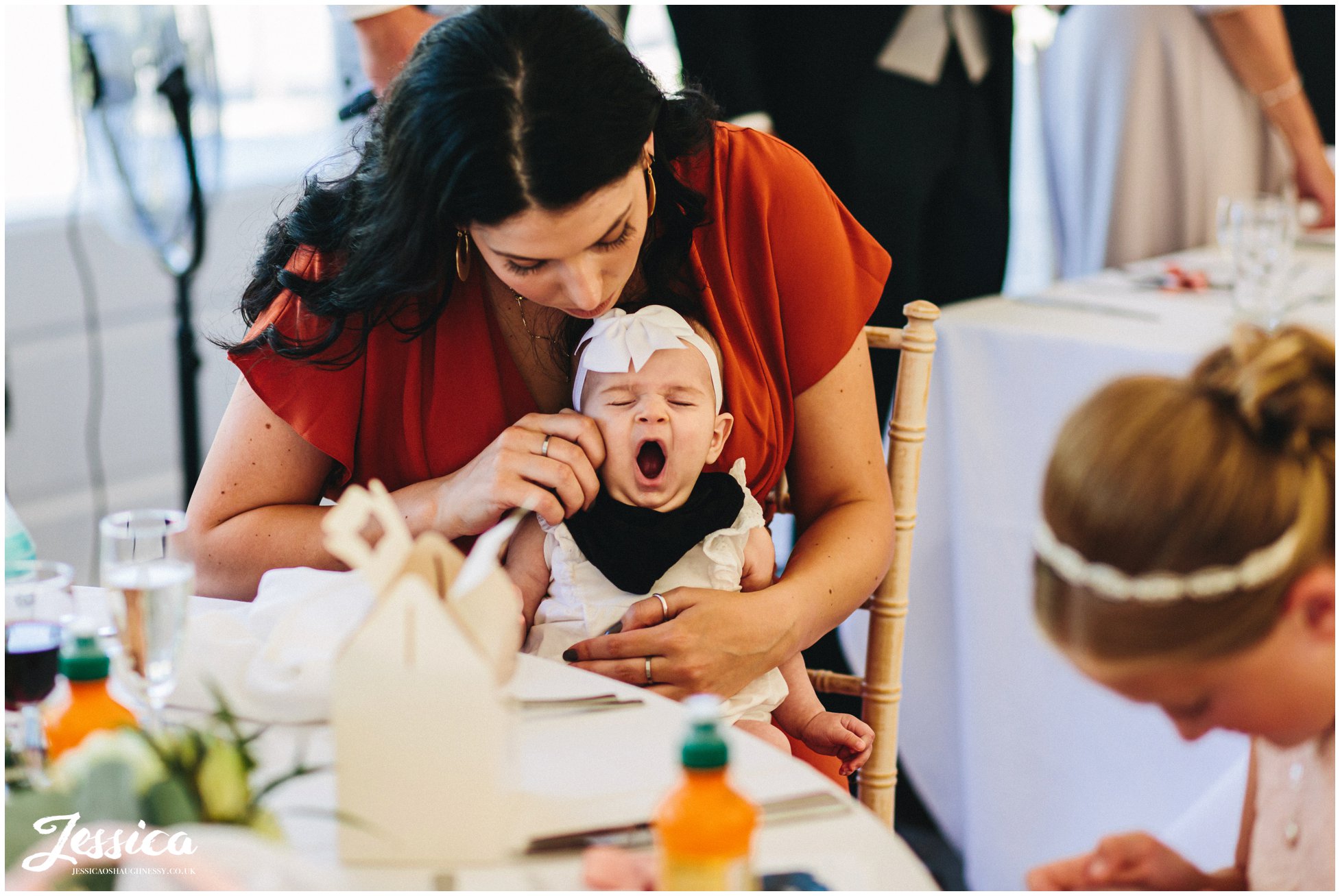 newborn baby yawns as the speeches start