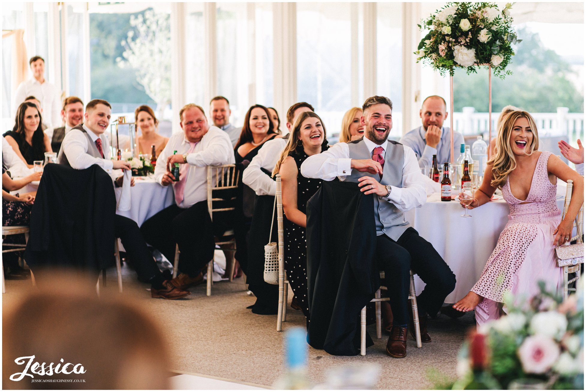 the room laughs during the best mans speech