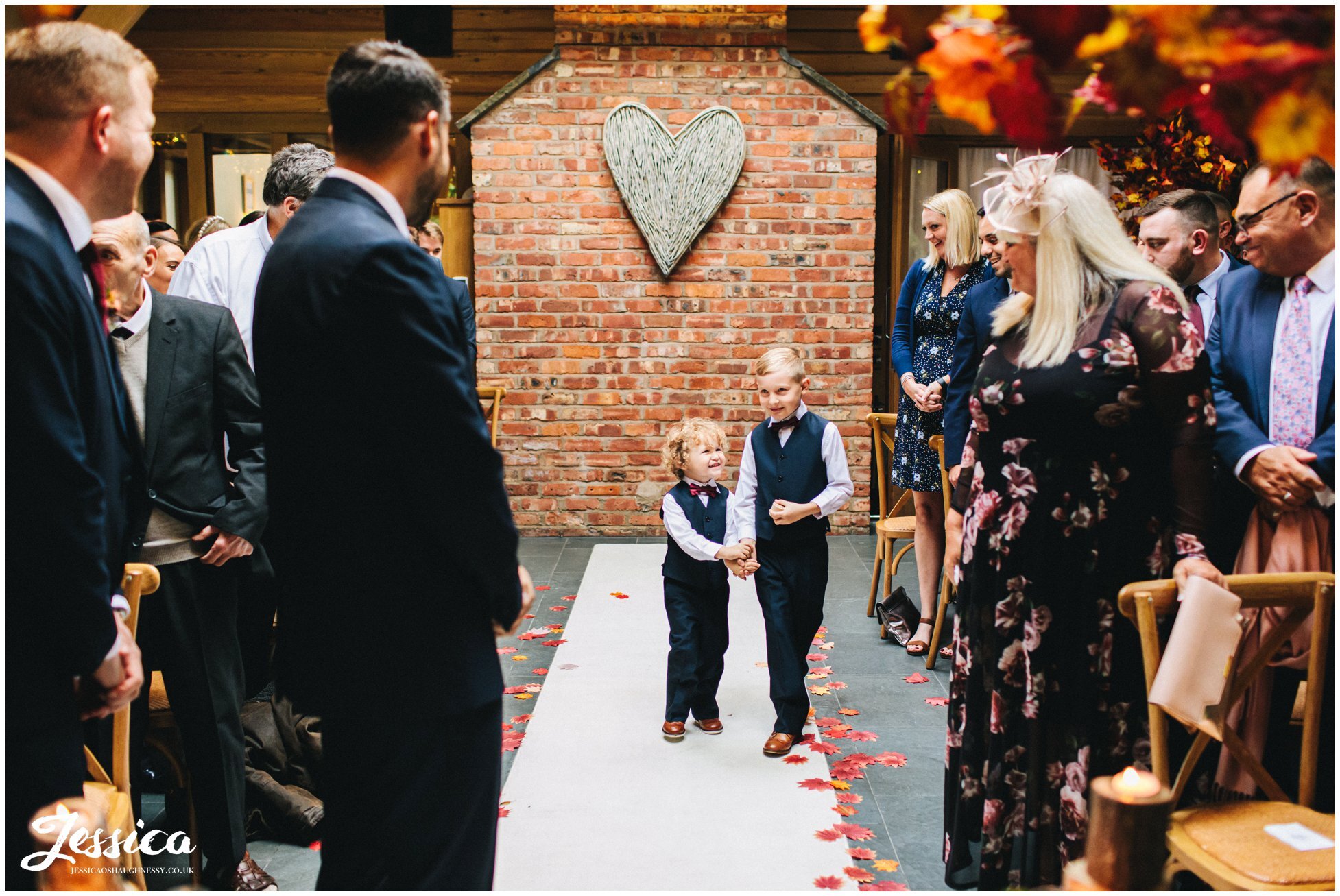 page boys walk down the autumnal aisle
