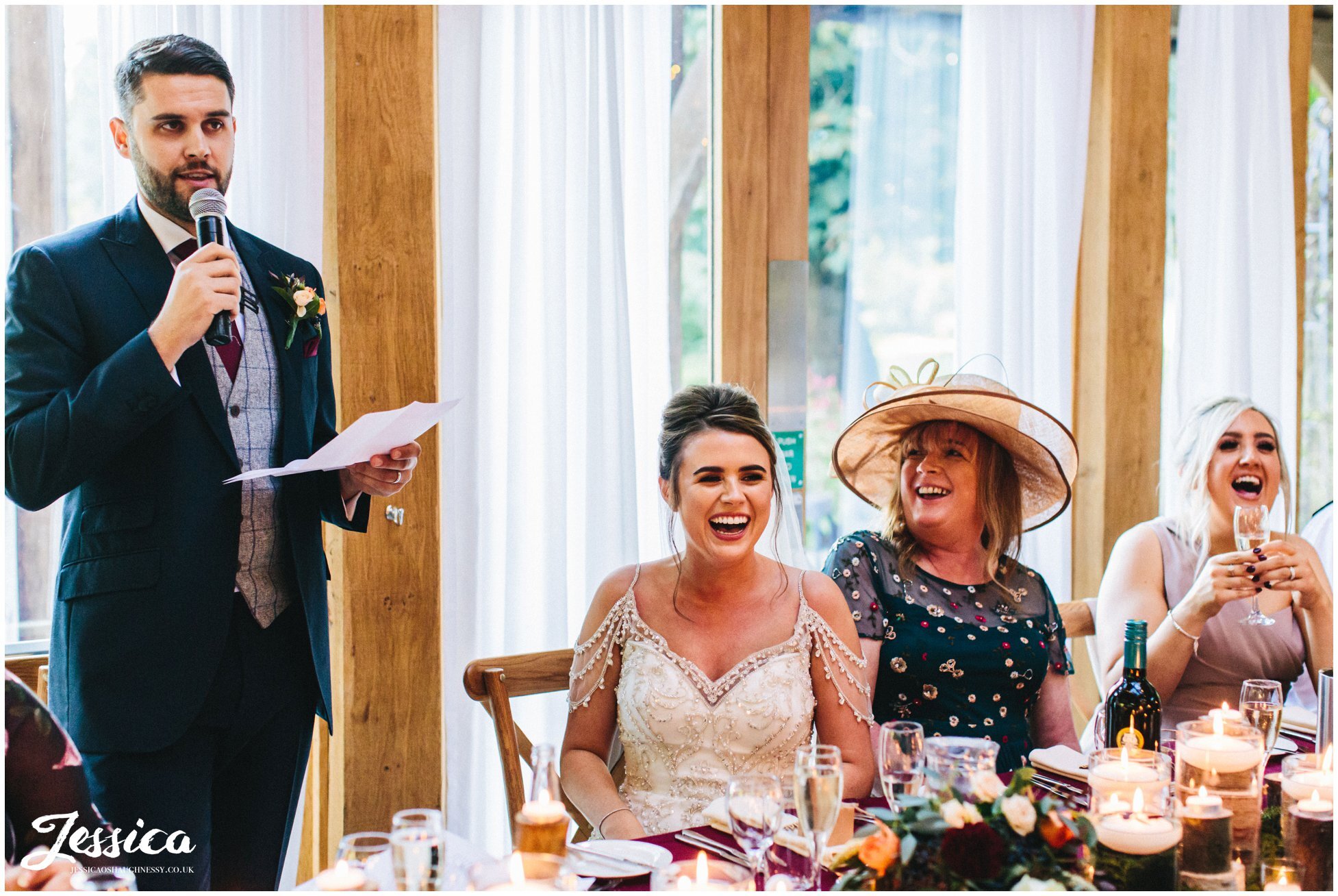 groom stands to give his speech at the cheshire wedding