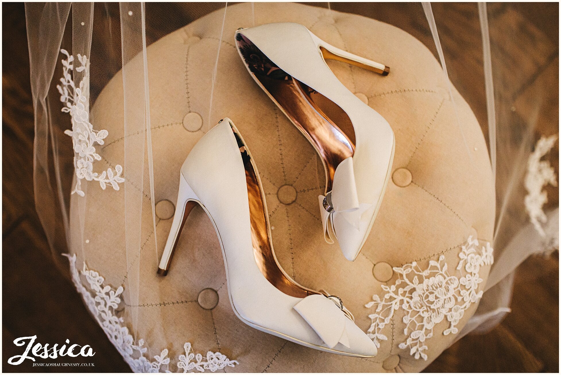 ivory ted baker shoes lying on the veil