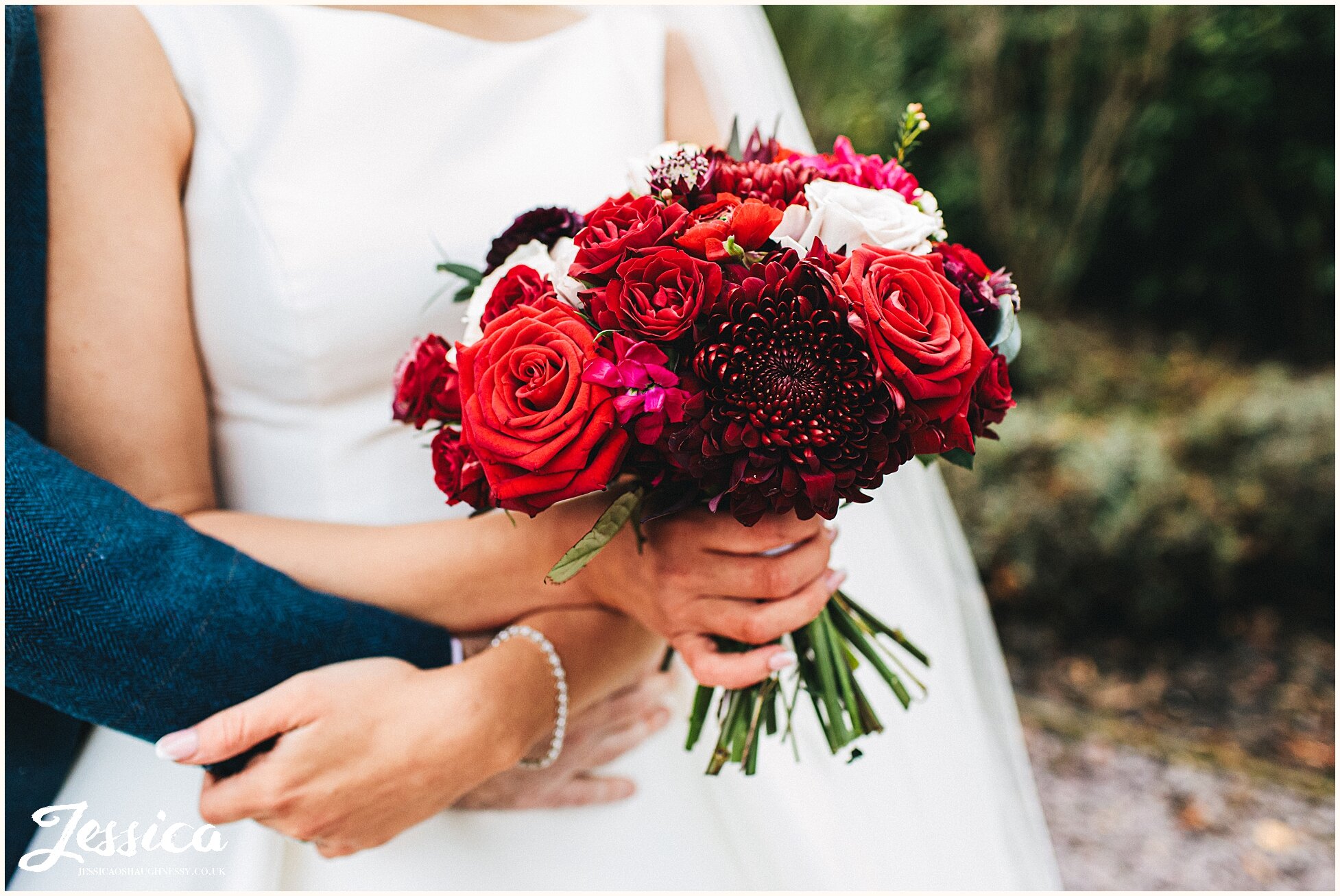 bride holds her festive bouquet