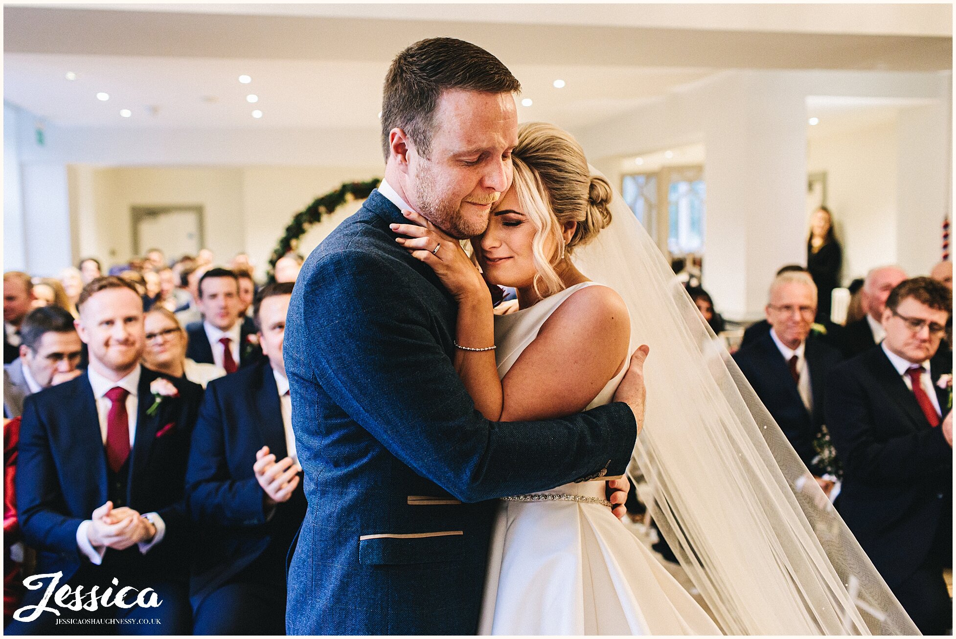 couple embrace as they are declared husband and wife