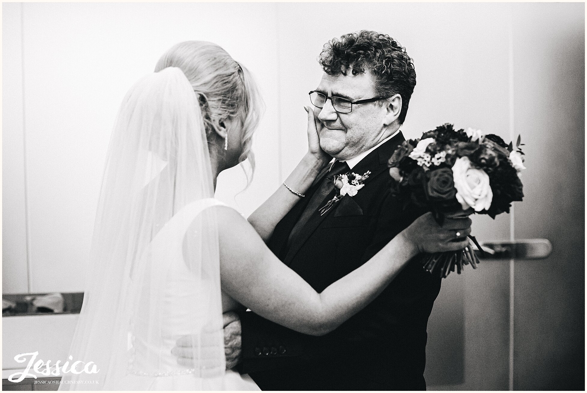 father of the bride see's his daughter in her dress for the first time