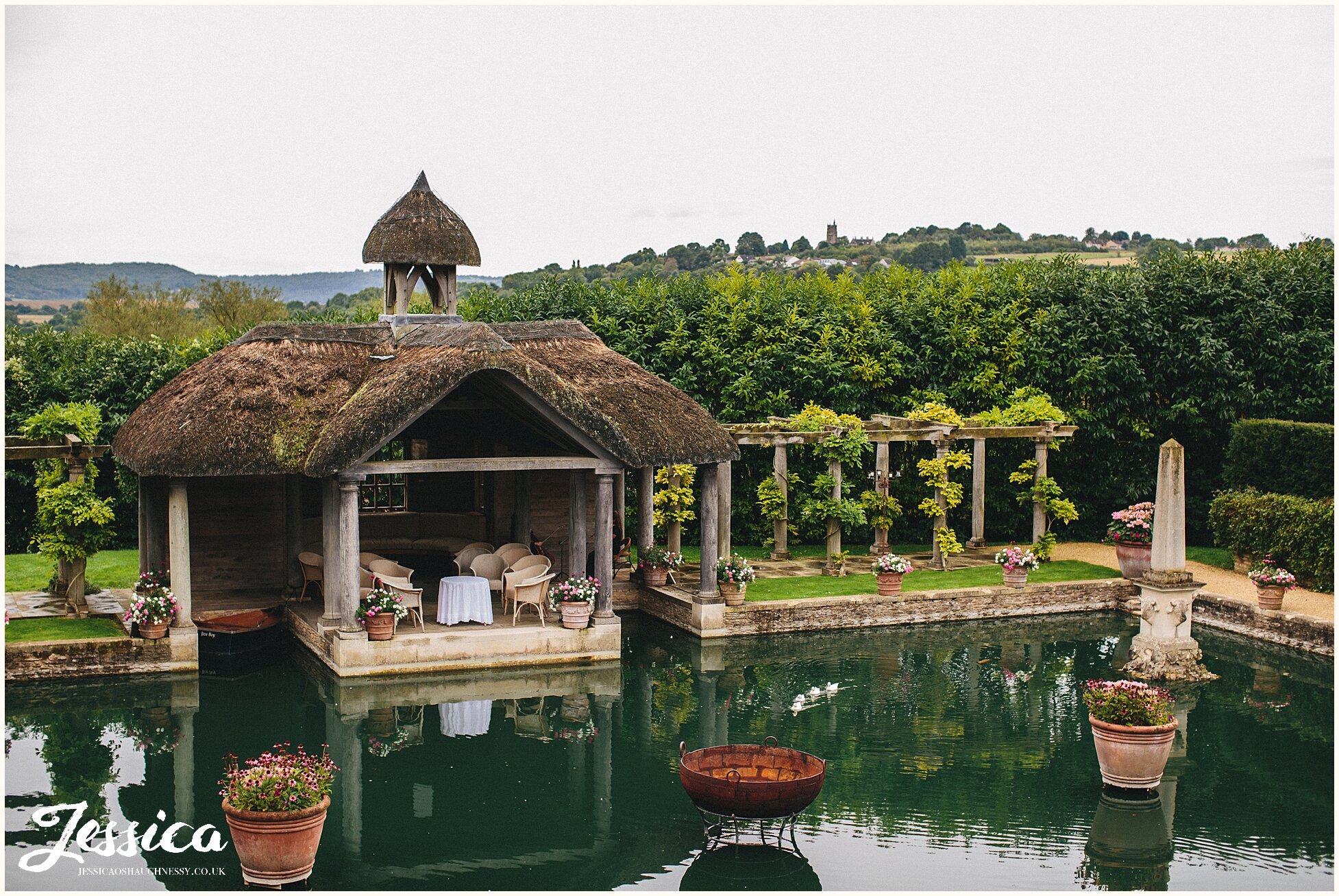 the boathouse at the lost orangery set up for the wedding ceremony