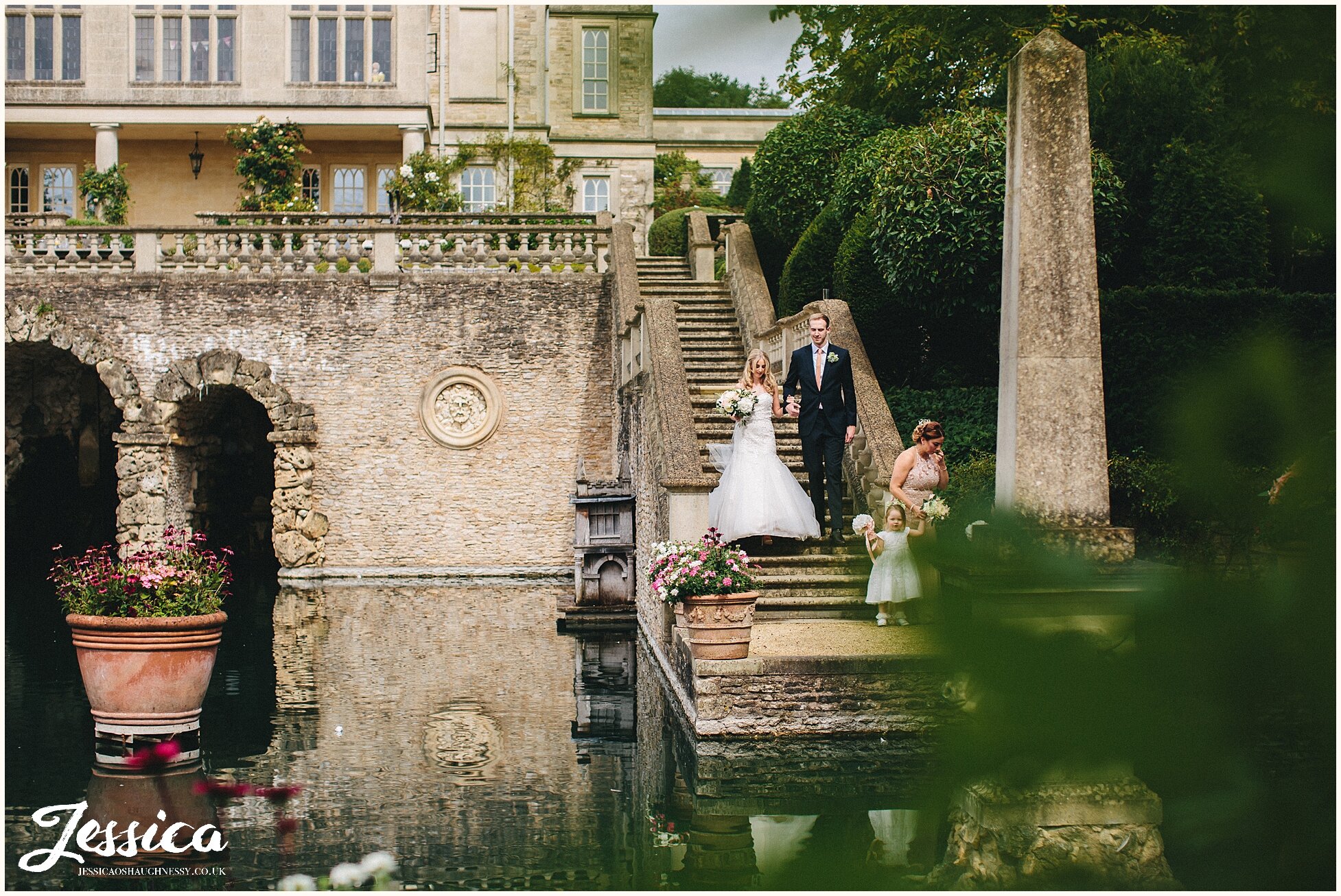 bride walks down the lost orangery staircase to her ceremony