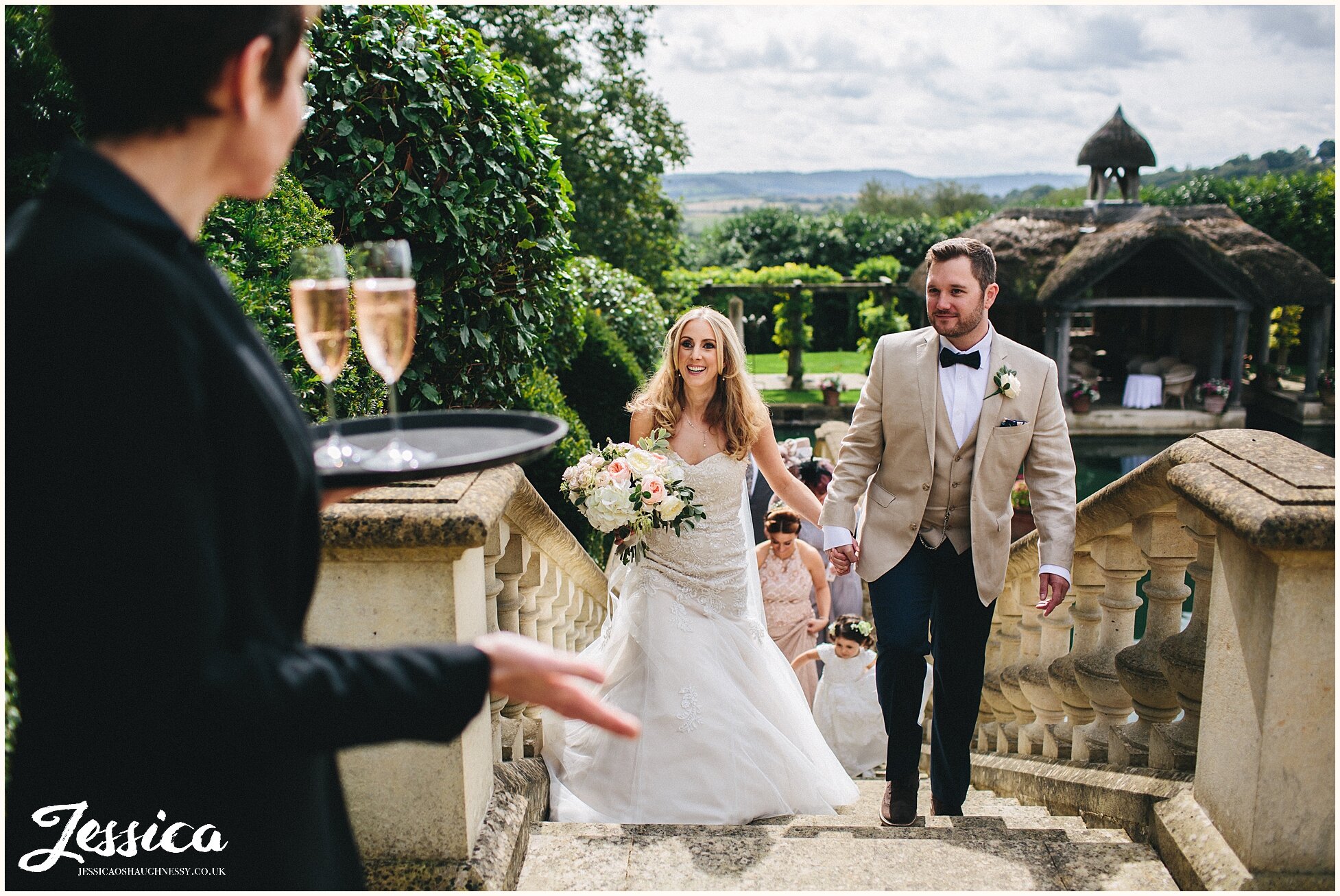 staff greet newly weds with champagne 