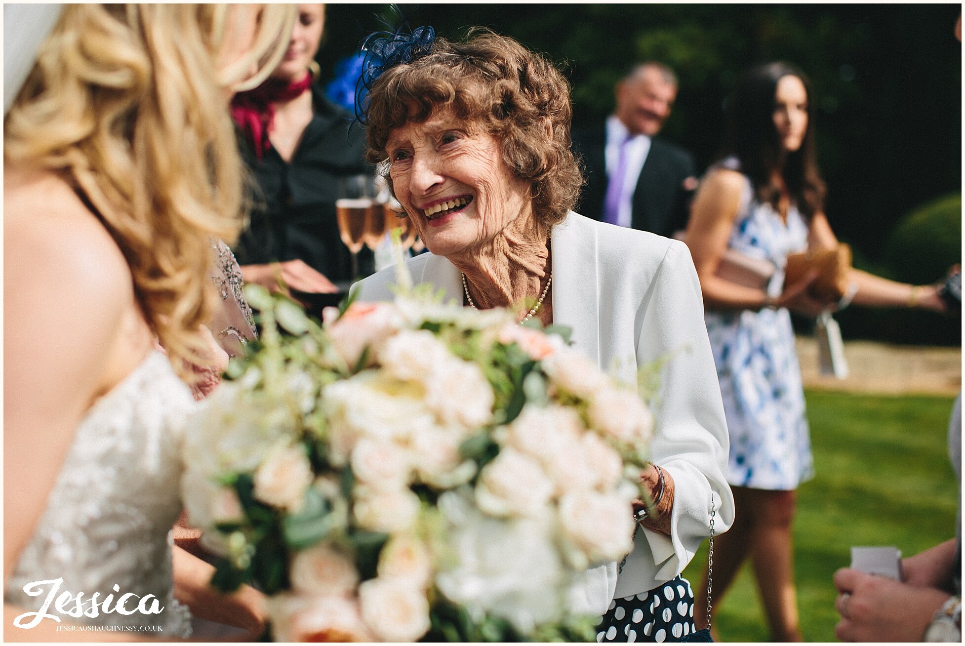 grandmother smiles at newly married bride in colerne