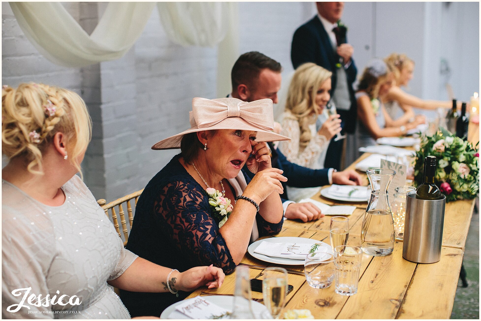 mother of the groom cries during the speeches at constellations wedding in liverpool