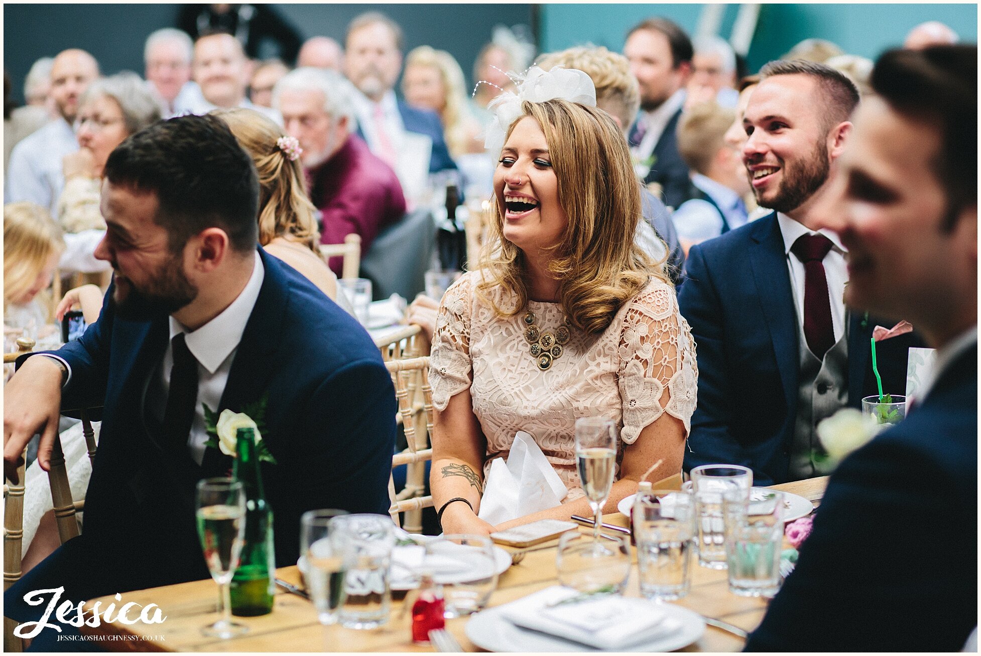 guests laugh during speeches at constellations wedding in liverpool