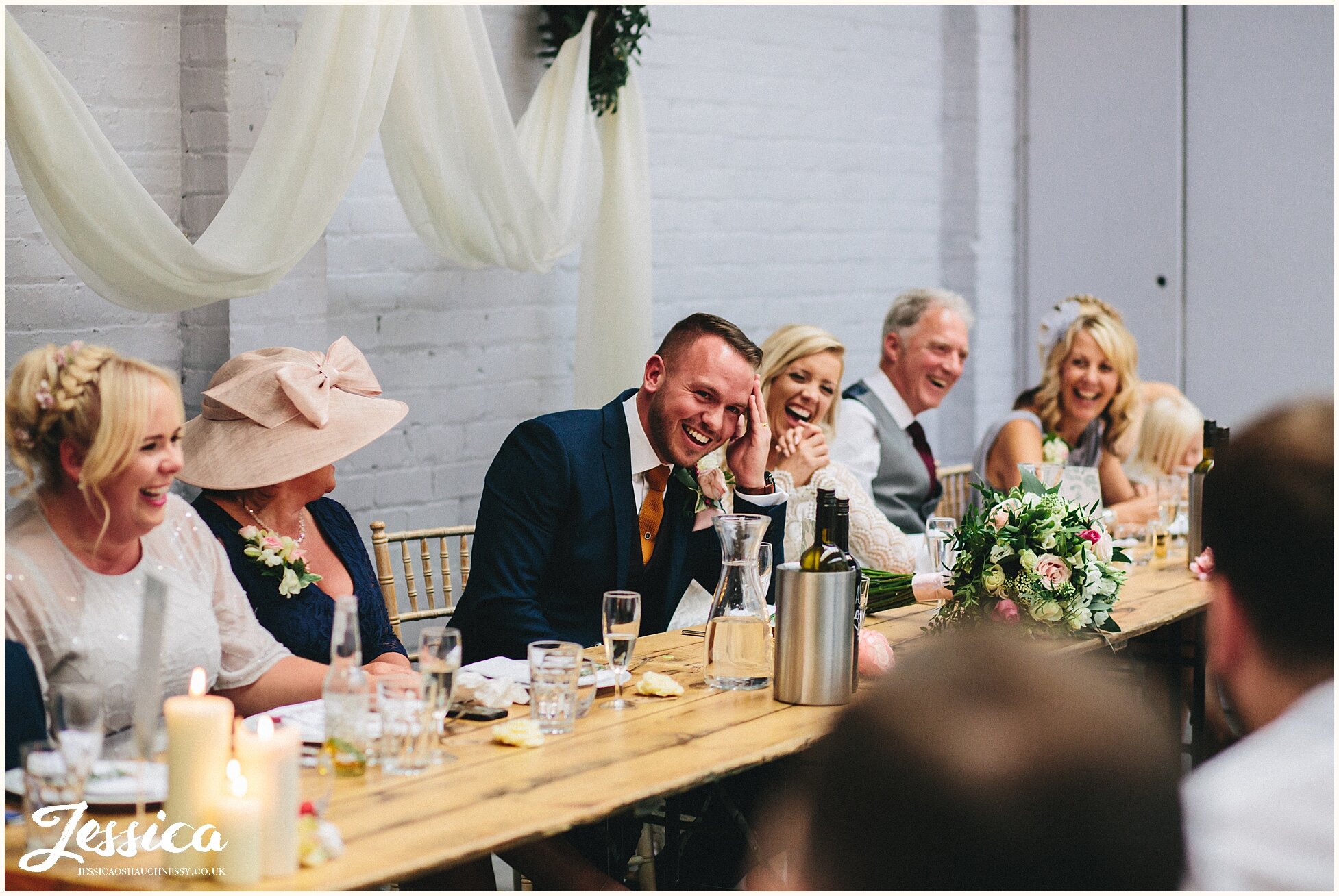 groom smiles at his new wife at constellations wedding venue in liverpool