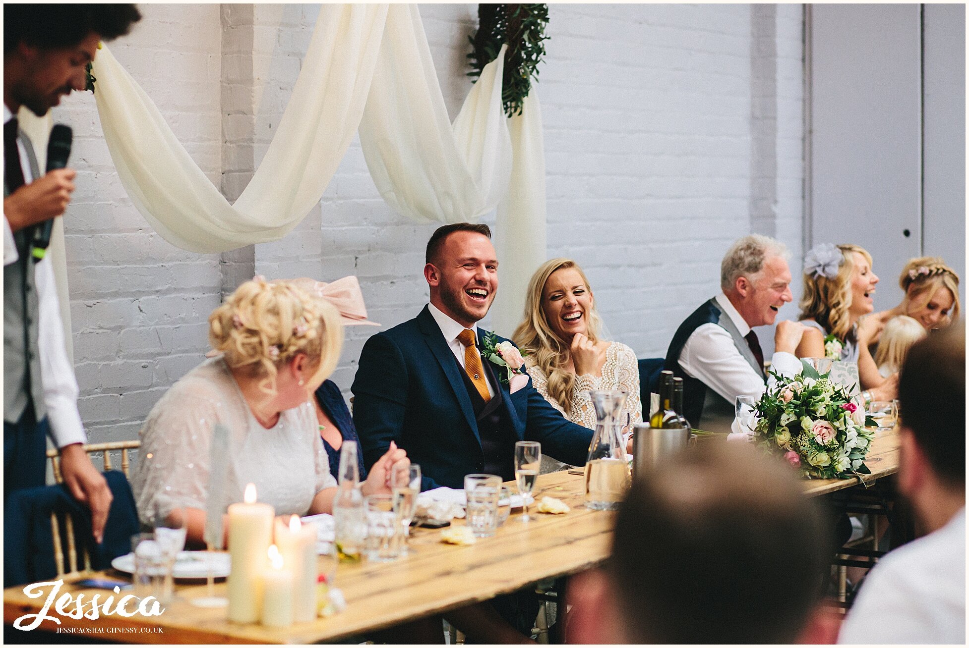 groom looks embarrassed during his best mans speech - liverpool wedding photographer
