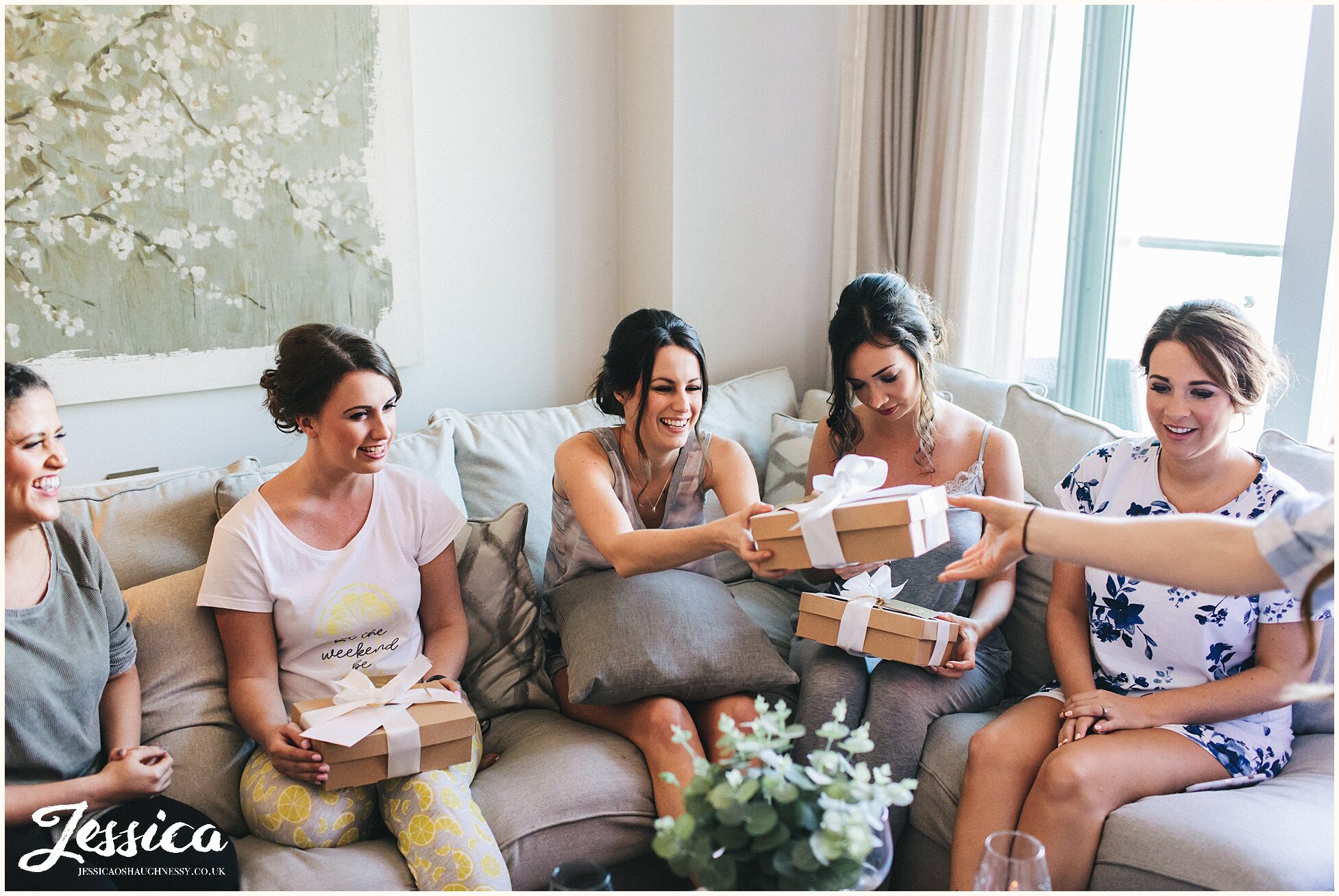 the bride gives her bridesmaids presents before the ceremony