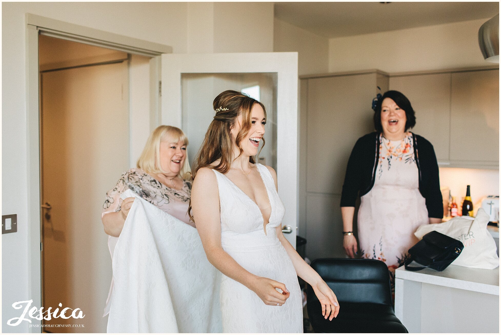 bride, mother &amp; aunty laugh as the bridesmaids cheer