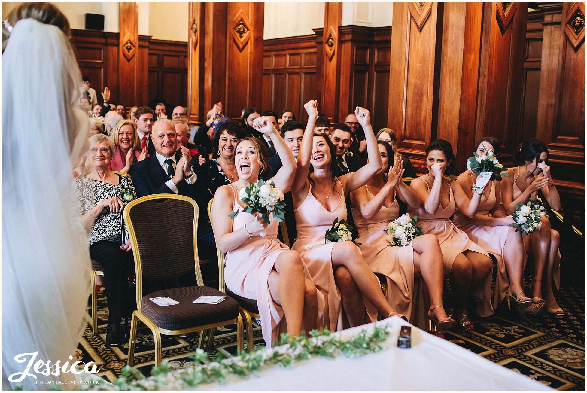 bridemaids cheer after the wedding ceremony at the midland hotel, manchester