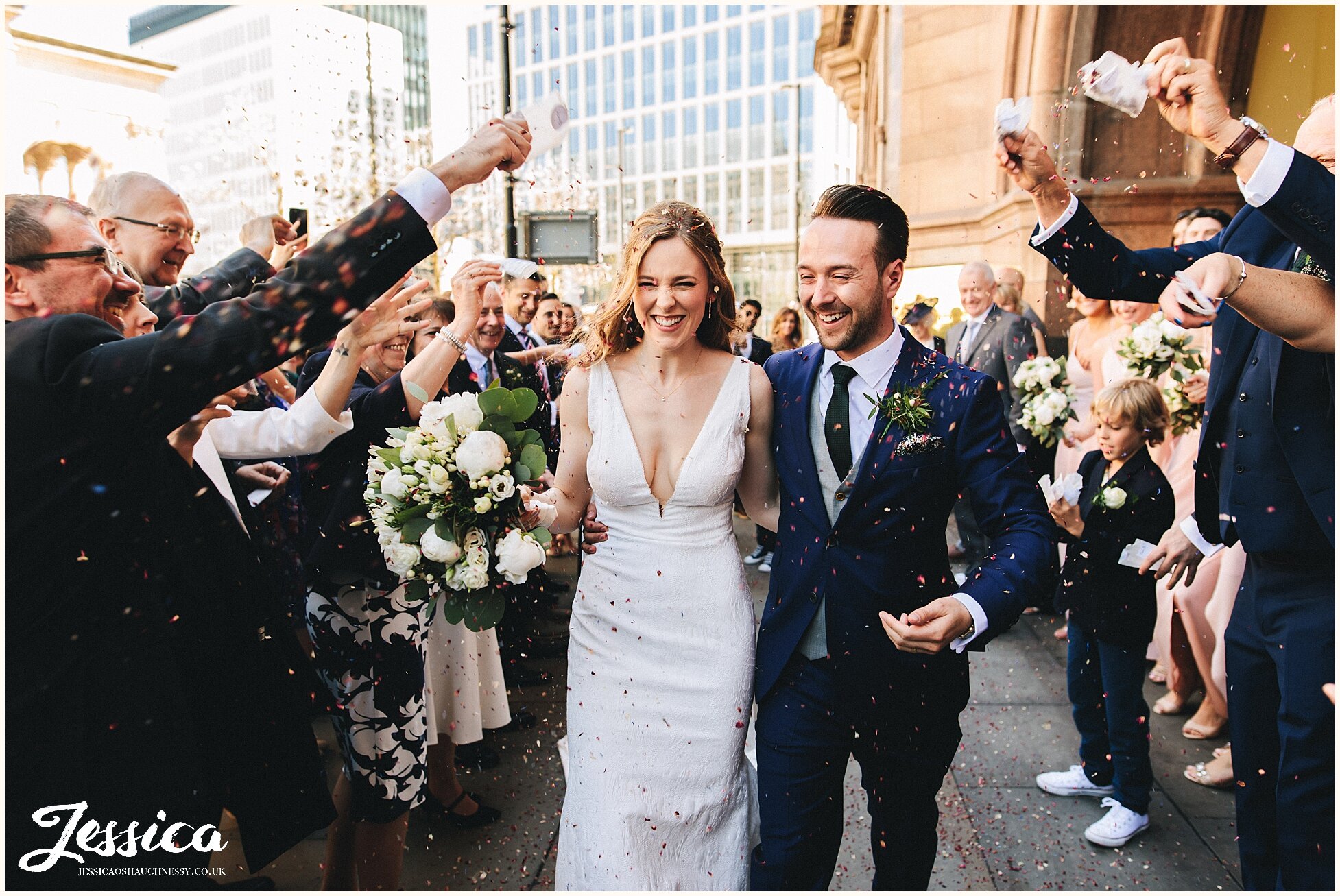 guests shower the couple with confetti outside the midland hotel