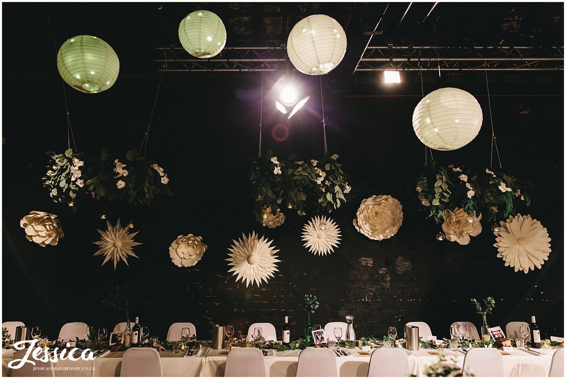 giant paper flowers &amp; gold dinosaurs decorate the wedding tables