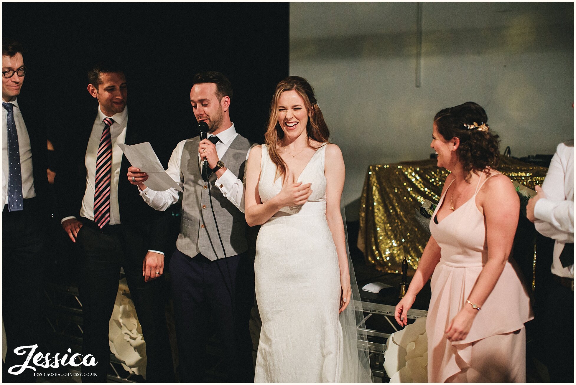 bride &amp; groom stand to say thanks to their guests at hope mill theatre in manchester 