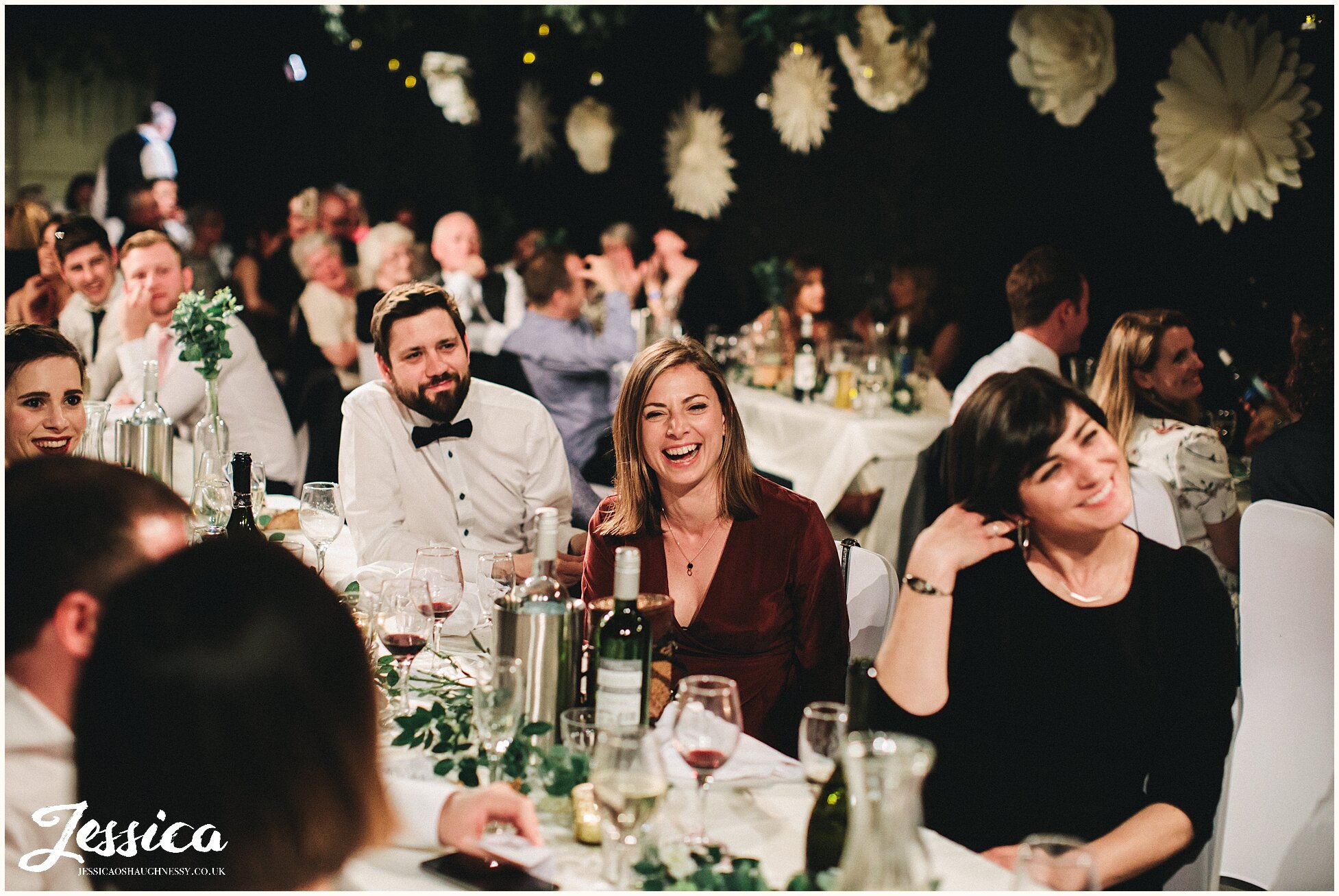 guests laughing during the wedding speeches in manchester