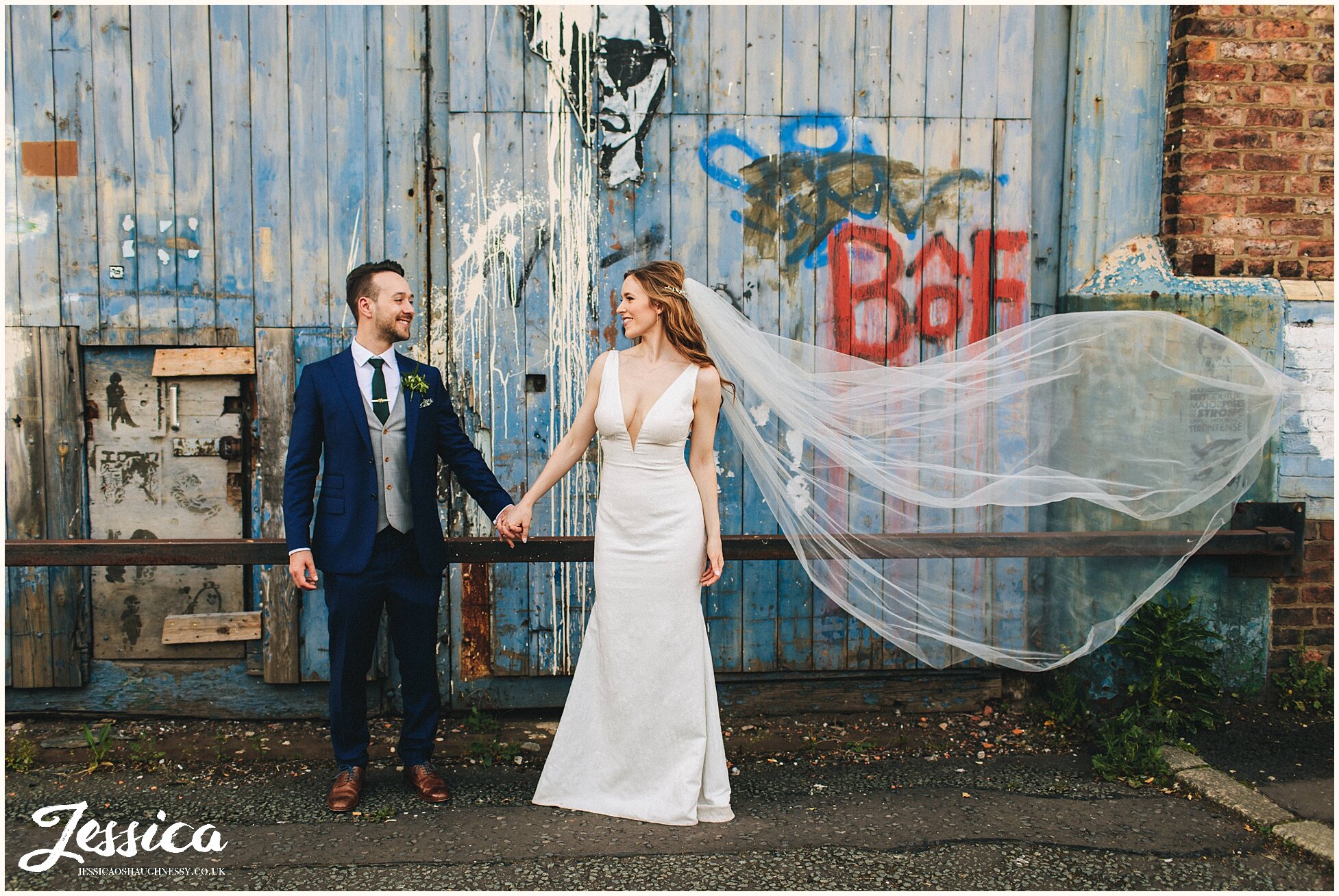 bride veil blows in the wind at her manchester wedding