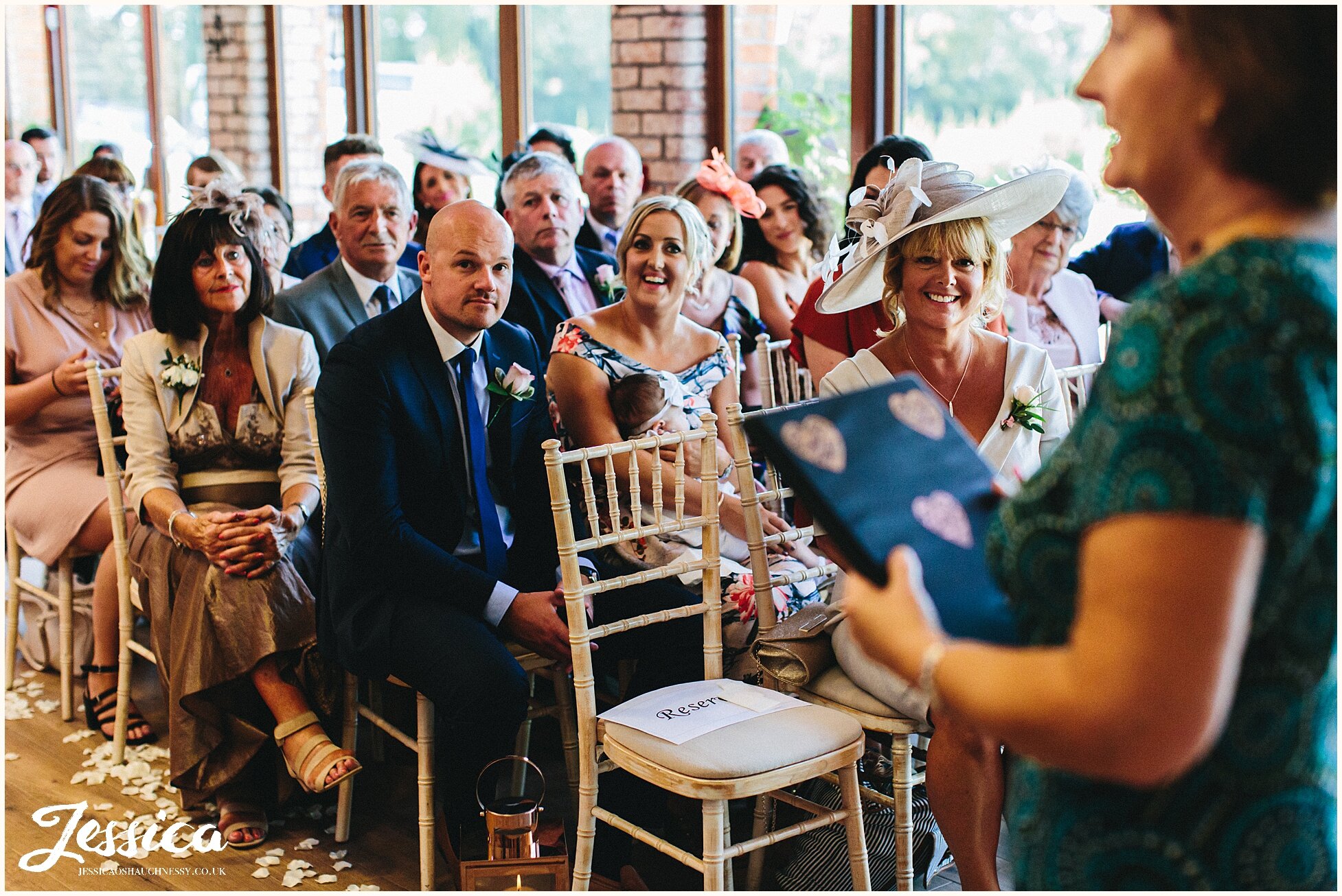 guests laughing before the ceremony begins