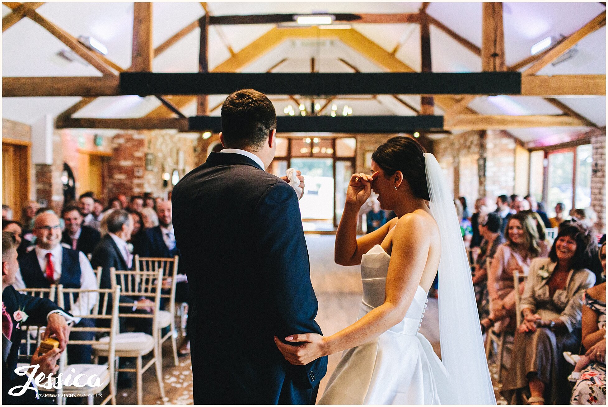 couple cry after their wedding ceremony ends